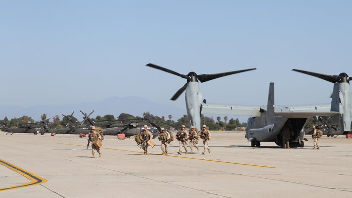 Marines from Company I, 3rd Battalion, 1st Marine Regiment depart from an MV-22B Osprey to conduct a simulated embassy reinforcement training exercise at Joint Reserve Training Center Los Alamitos, California, April 11, 2015. The embassy reinforcement operation was a part of the 15th Marine Expeditionary Unit’s certification exercise, the last training exercise the MEU conducts before deployment.