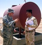 A Joint Expeditionary Tasking Airman assigned to the 732nd Air Expeditionary Group serves as an advisor to Iraqi military members. JET Airmen typically work for other U.S. military services and often perform functions not usually associated with the Air Force. The 732nd AEG recently moved its headquarters staff out of Iraq to join the 386th Air Expeditionary wing here, but its JET Airmen will remain in Iraq to perform a variety of combat support missions like construction, communications and logistics.