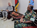 Maj. Dan Schilling, the former director of the Oregon National Guard’s State Partnership Program, meets with Lt. Gen. Mohammed Abdul Wadud, the principle staff officer for the Armed Forces Division of Bangladesh in Dhaka, Aug. 9, 2010.  Schilling and officials from the Portland International Airport met with Bangladeshi transportation officials to discuss security and safety protocols, based on a collaborative work plan developed in April. The group also discussed joint training and information sharing for disaster response, humanitarian aid, and training exercises as part of an overall SPP strategic plan.