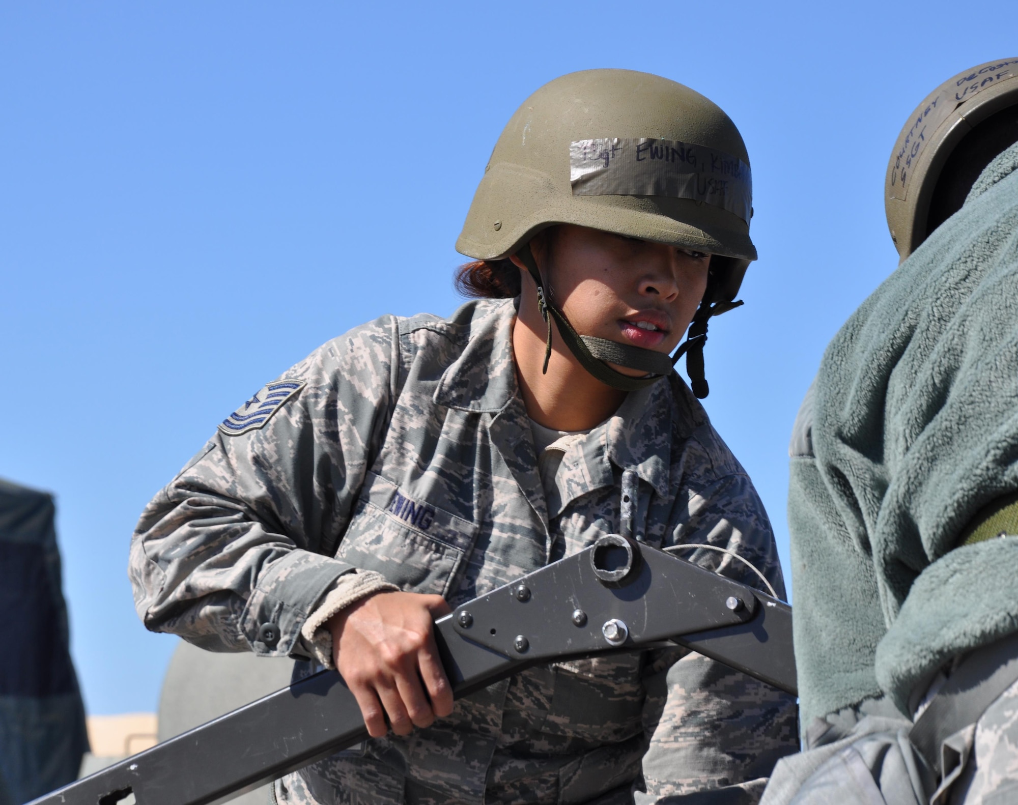 Tech. Sgt. Kimberlee Ewing,  301st Services Flight, assembles a single palletized expeditionary kitchen during the exercise March 6. Within 24 hours, nearly 140 Airmen from seven squadrons throughout the 301st Fighter Wing traveled through a personnel-processing line and then carried out their duty-specific tasks in a simulated deployed environment. (Air Force photo/Capt. Candice Allen) 