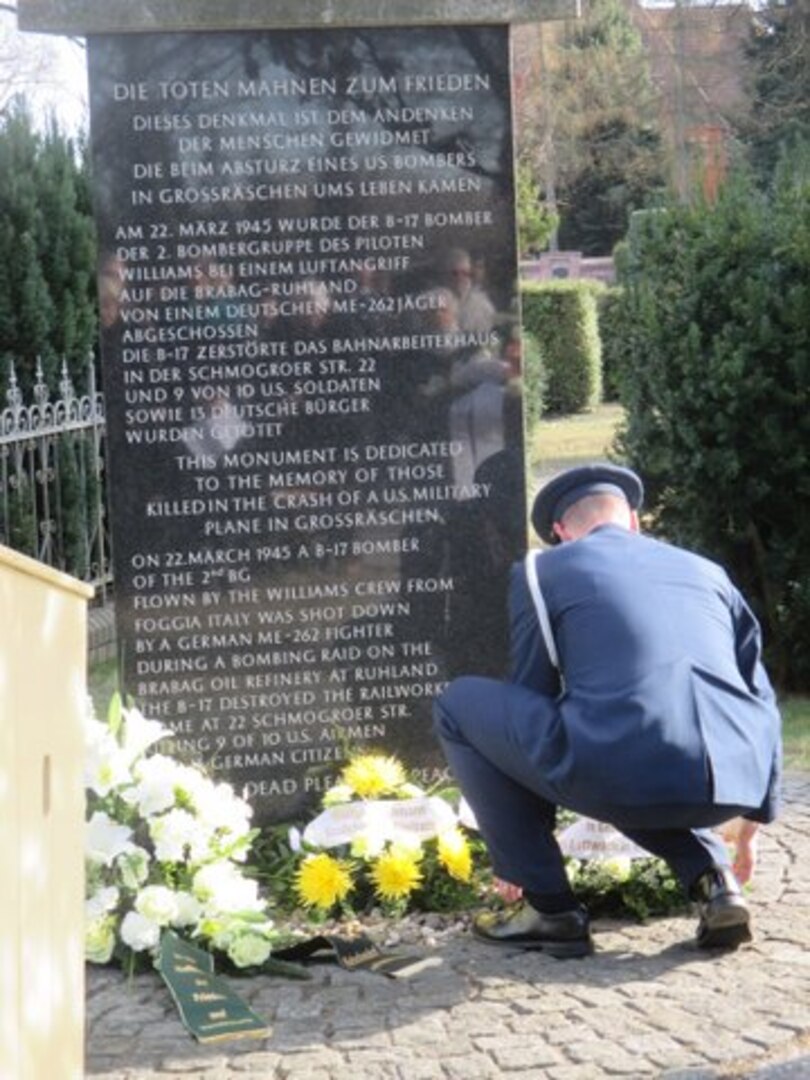 Col David Pedersen, air attaché to Germany, lays flowers at the Peace Memorial Monument in Großräschen, Germany, which honors the American crewmembers and German civilians killed in the crash of an American B-17.