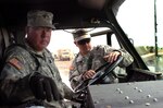 Staff Sgt. Hussey shows Spc. Grant Flegel the interior controls of the HEMTT wrecker during a training session at the Gowen Field Training Area in Idaho for the upcoming deployment of the 116th Calvary Brigade Combat Team of the Idaho National Guard. This training session is to teach the drivers of the HEMTTs to be better able to handle any problems with their vehicle and helping to tow other broken down vehicles.