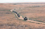 A convoy from Alpha Company, 145th Brigade Support Battalion roll back from an IED training lane at Gowen Field Training Area, Idaho, Monday, Aug. 30. The convoy is practicing how to spot IED's and what measures to take when they spot one.