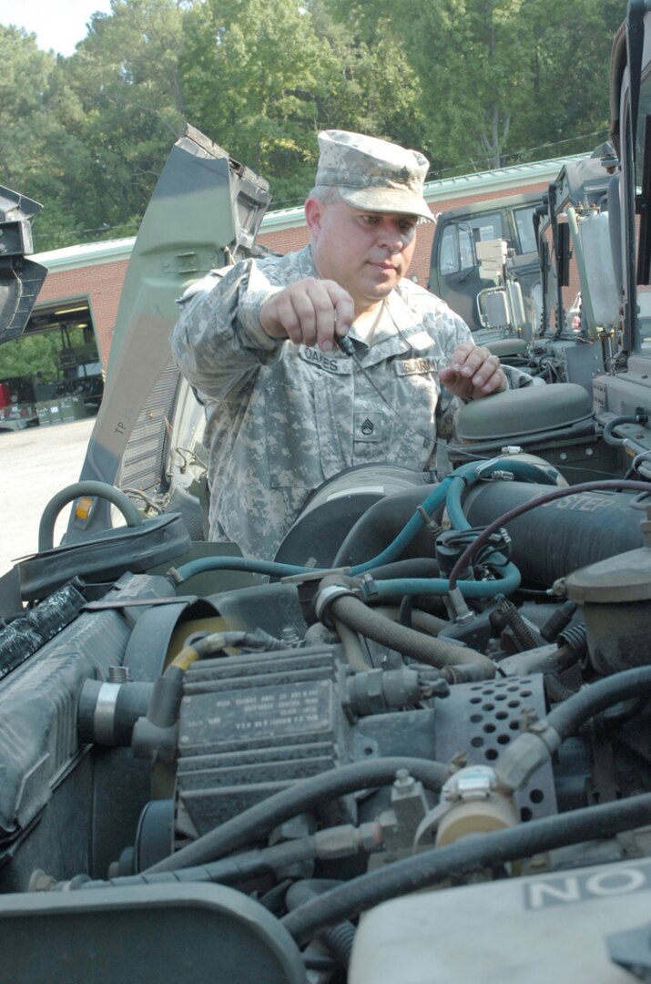 Staff Sgt. Lee Oakes checks the oil on a Humvee as Soldiers from the Virginia National Guard's Norfolk-based 1st Battalion, 111th Field Artillery Regiment prepare their vehicles for a possible state mobilization in response to Hurricane Earl on Sept. 1, 2010. The Virginia National Guard will bring up to 200 Soldiers and Airmen on state active duty starting Sept. 1 for possible post-storm recovery operations should Hurricane Earl impact the Hampton Roads area. Virginia Guard personnel will begin staging Sept. 1 and will be pre-staged and ready Sept. 2 to support potential response missions before Hurricane Earl reaches the Virginia coastline.