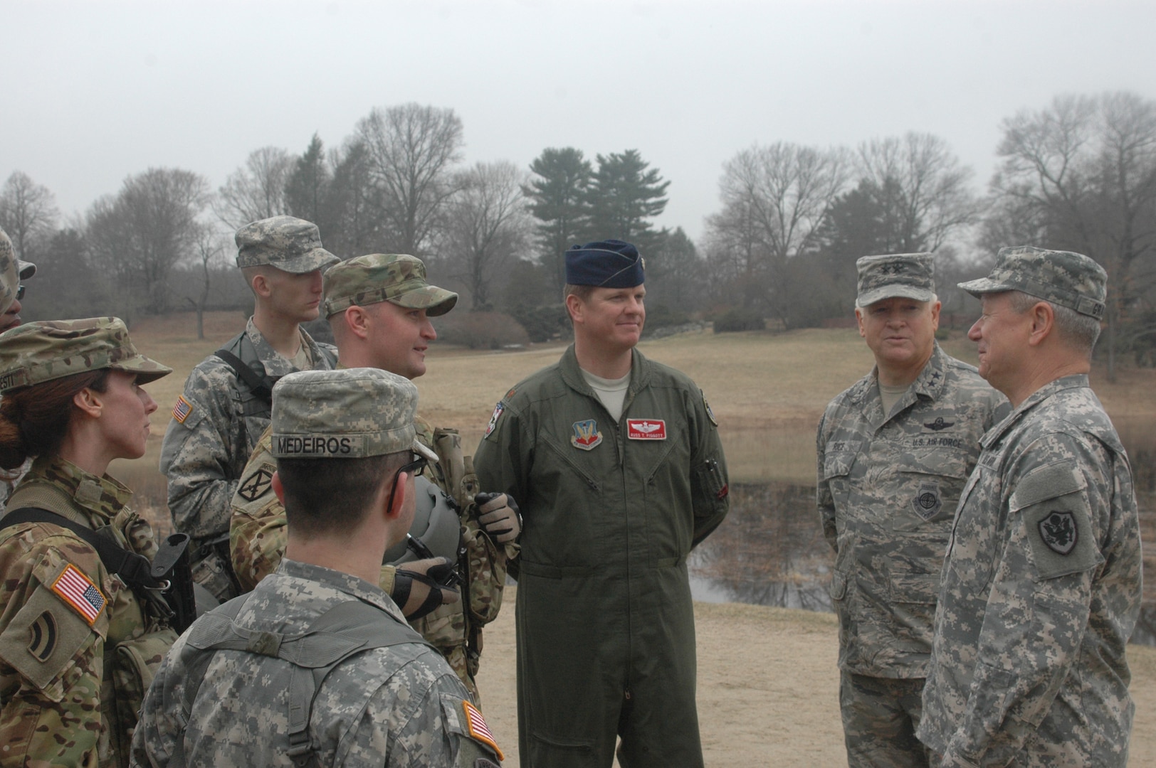 Gen. Frank J. Grass, Chief National Guard Bureau and Maj. Gen. L. Scott Rice, Adjutant General, Massachusetts National Guard, speak with Soldiers and Airmen of the Massachusetts National Guard at the North Bridge battle site at Minuteman National Historic Park, April 10, 2015.