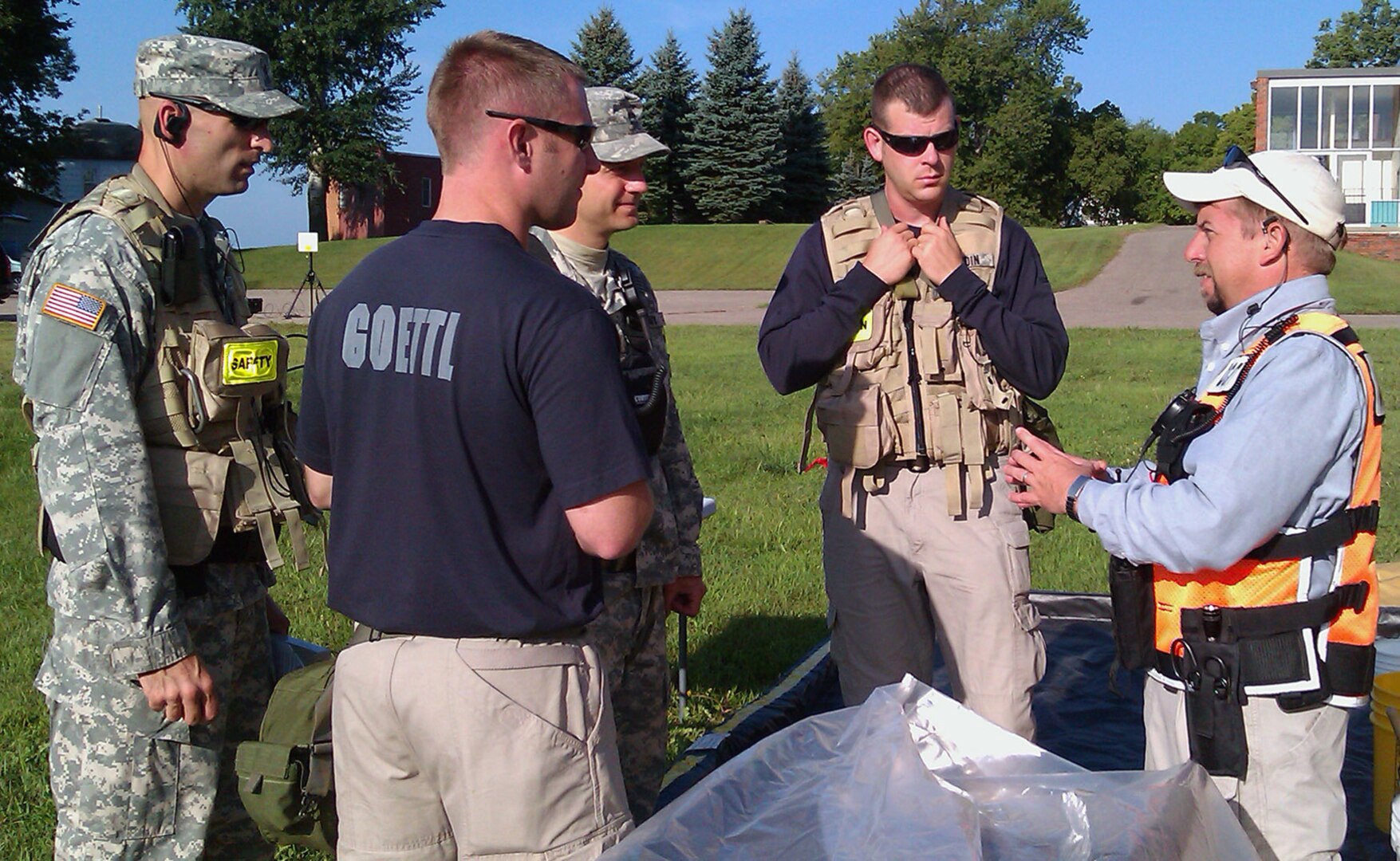 Jeff Carter, an observer controller/trainer from Civil Support Training Activity at U.S. Army North, based in Fort Sam Houston, Texas, briefs members of the Minnesota National Guard's 55th Civil Support Team from Fort Snelling, Minn., during their annual pre-evaluation training exercise Aug. 24, 2010.