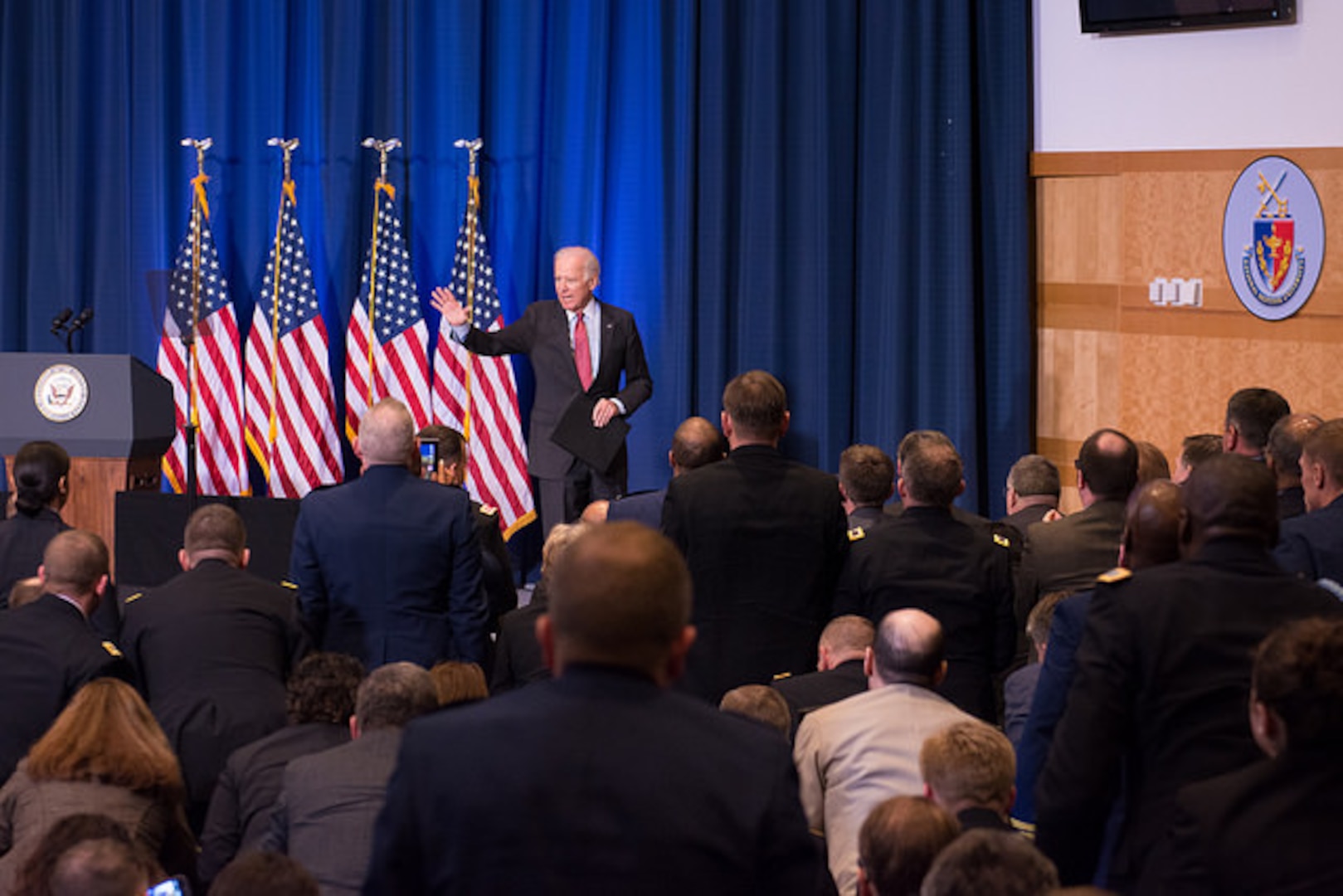 Vice President Joe Biden waves to audience members in Lincoln Hall at NDU on 9 April 2015.