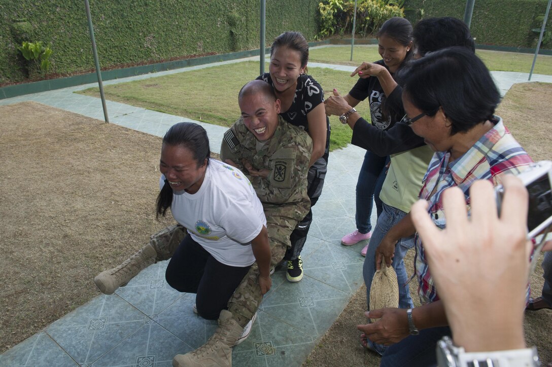 U.S. Army Spc. Neil Bautista, assigned to the 97th Civil Affairs Battalion, acts as a patient during first responder training in Tapaz, Philippines, during Balikatan 2015, April 14. The training was held for local health workers by U.S. and Armed Forces of the Philippines Army personnel as part of a Joint Civil-Military Operations Task Force on the island of Panay for the exercise. Balikatan, which means “shoulder to shoulder” in Filipino, is an annual bilateral training exercise aimed at improving the ability of Philippine and U.S. military forces to work together during planning, contingency, humanitarian assistance and disaster relief operations. 