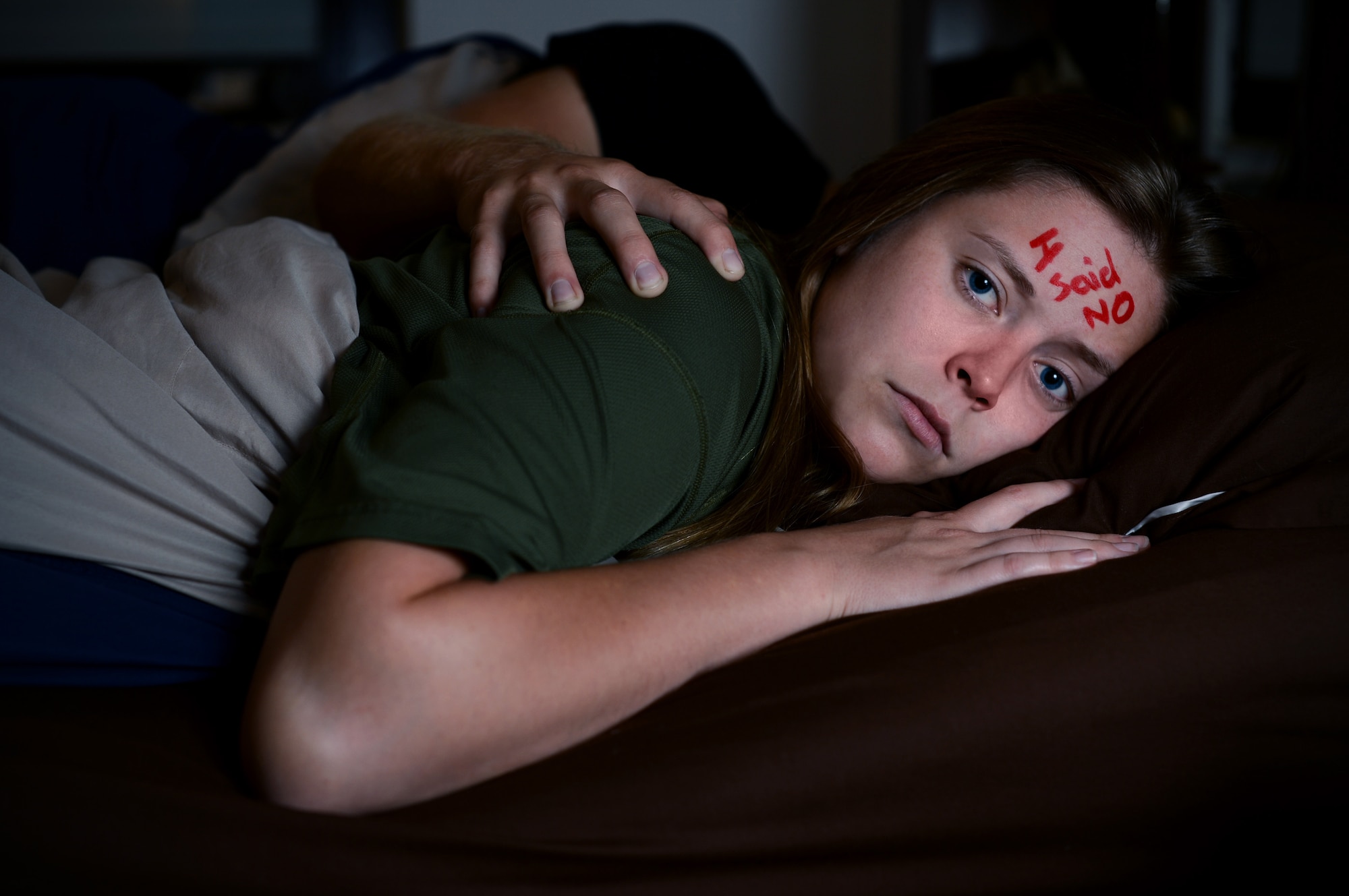 U.S. Air Force Airman 1st Class Kayleen Moss, a 52nd Medical Operations Squadron pediatrics technician, and her husband, Brandon, pose for an anti-sexual assault campaign image at Spangdahlem Air Base, Germany, Aug. 13, 2014. The Air Force Sexual Assault Prevention and Response program provides services to assist victims and survivors of sexual violence. SAPR has an ongoing campaign to encourage people to step up and step in to prevent sexual assault. Victims can reach a trained victim advocate 24/7 on the Whiteman Air Force Base SAPR confidential hotline at 660-687-7272.  (U.S. Air Force photo by Airman 1st Class Kyle Gese/Released)