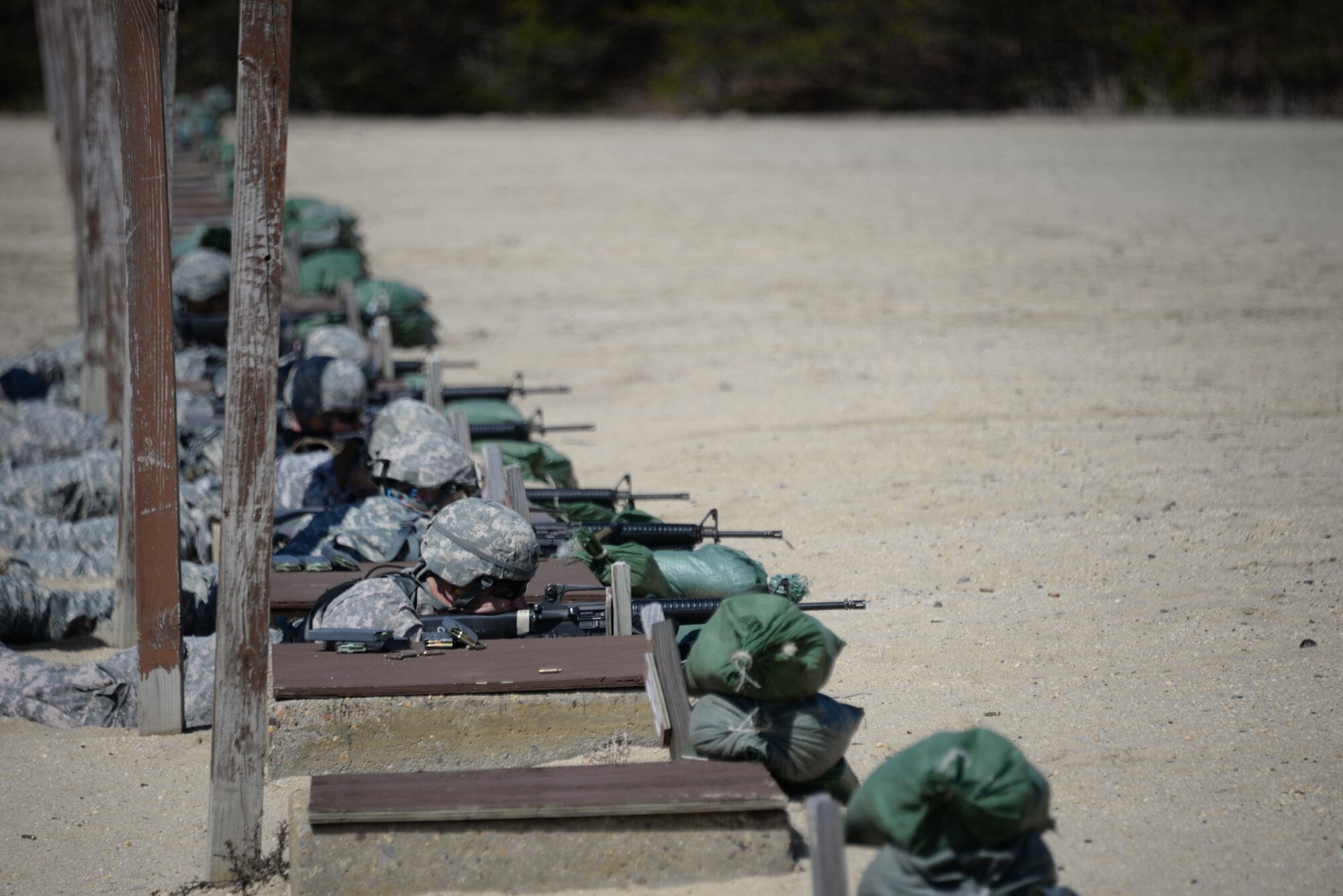 Soldiers from the 75th Training Command participate in the rifle marksmanship event during the Best Warrior Competition on Joint Base McGuire-Dix-Lakehurst, N.J., April 11, 2015. The competition was comprised of events including the Army physical fitness test, day and night land navigation, as well as combat and first aid skills. (U.S. Air Force photo/Airman 1st Class Lauren Pitts)
