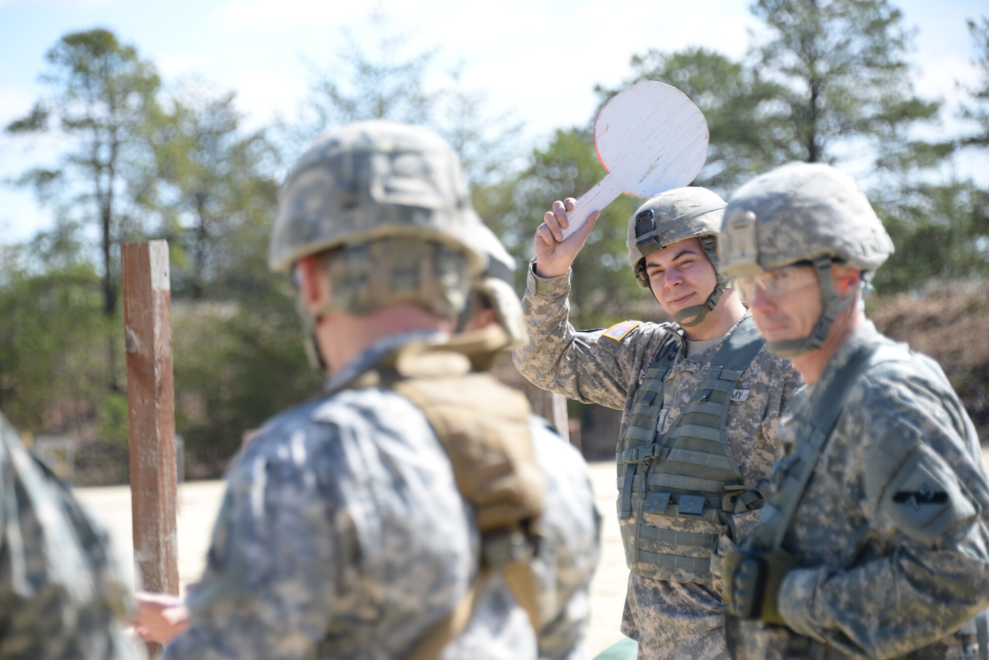 A Soldier from the 75th Training Command Atlantic Division signals that the range is clear during the Best Warrior Competition on Joint Base McGuire-Dix-Lakehurst, N.J., April 11, 2015. The BWC tests Soldiers on their mental and physical skills, including rifle marksmanship. (U.S. Air Force photo/Airman 1st Class Lauren Pitts) 