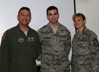 Airman 1st Class Austin Carlman, center, 47th Operations Support Squadron air traffic controller, poses with Col. Brian Hastings, 47th Flying Training Wing commander, and Chief Master Sgt. Teresa Clapper, 47th FTW command chief, after being notified of his acceptance into the Air Force Academy Preparatory School at Laughlin Air Force Base, March 25, 2015. In the summer of 2015, Carlman will begin a 10-month long program that emphasizes a curriculum much like the Air Force Academy's. (U.S. Air Force Photo by Airman 1st Class Ariel D. Delgado)