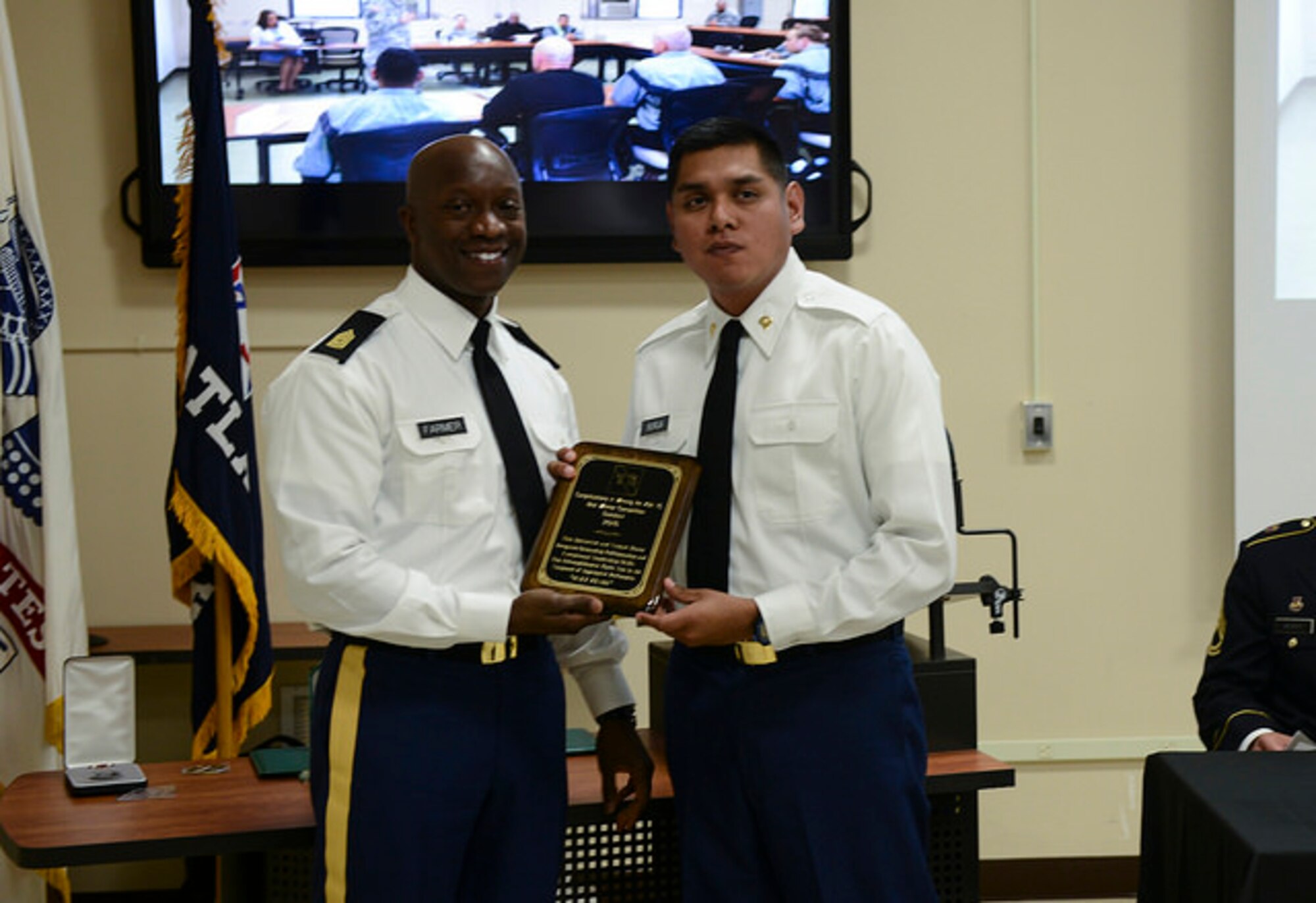 75th Training Command Command Sgt. Maj. Ronnie Farmer awards Army Spc. Sergio Borja, a resident of California and a member of the 75th Training Command Pacific Division, a Best Warrior Competition Soldier of the Year plaque on Joint Base McGuire-Dix-Lakehurst, N.J. April 12, 2015. Borja will advance to represent the 75th TC at the U.S. Army Reserve Best Warrior Competition at Fort Bragg, N.C. in May. (U.S. Air Force photo by Airman 1st Class Joshua King)