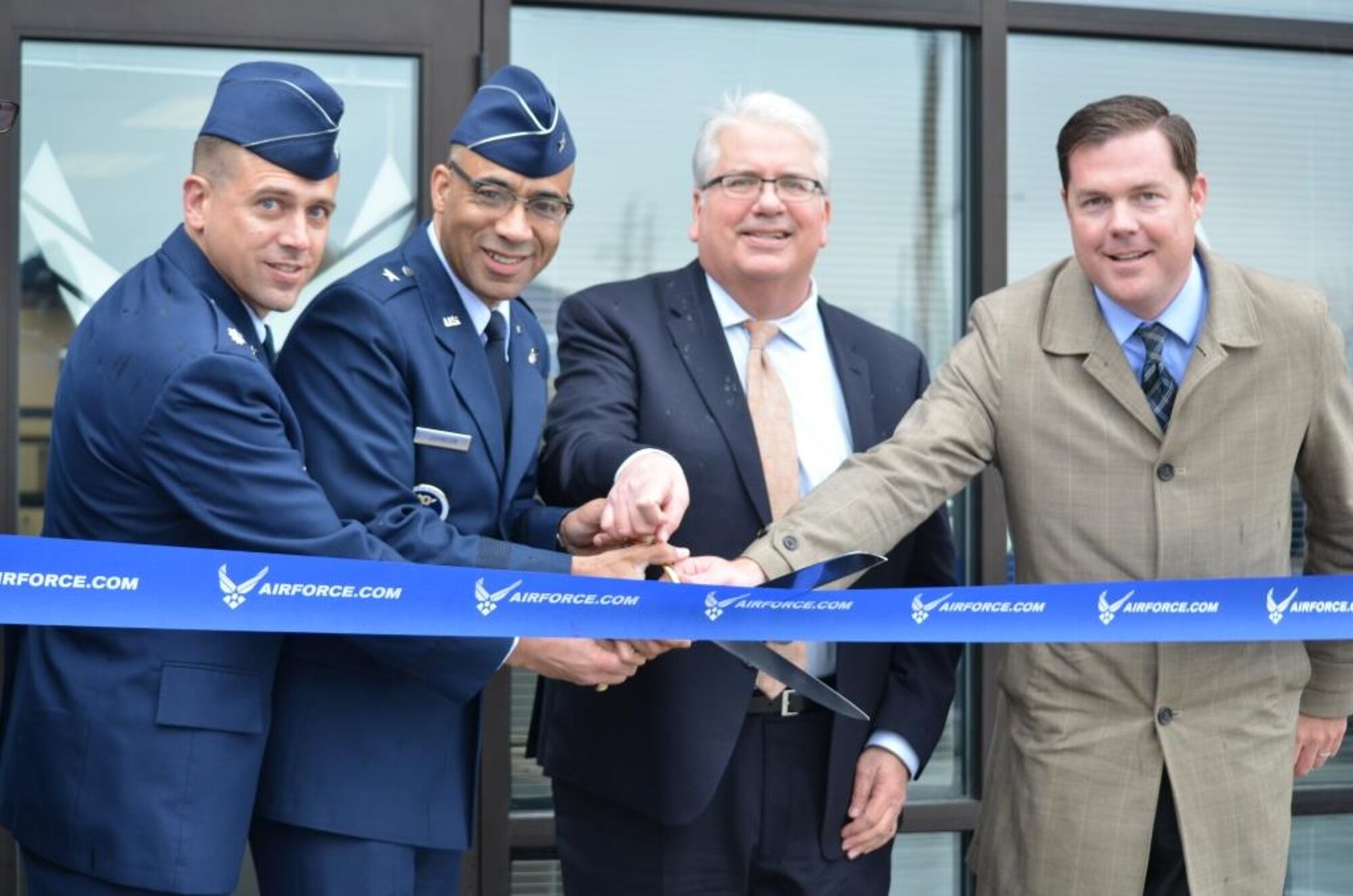 Air Force and community leaders cut a ribbon April 8 during the ribbon cutting ceremony of the AFRS’s newest hub in Waukee, Iowa. The hub is part of a Flight-Centric Transformation program designed to consolidate recruiting offices. (U.S. Air Force photo/Senior Master Sgt. Michael Galea)