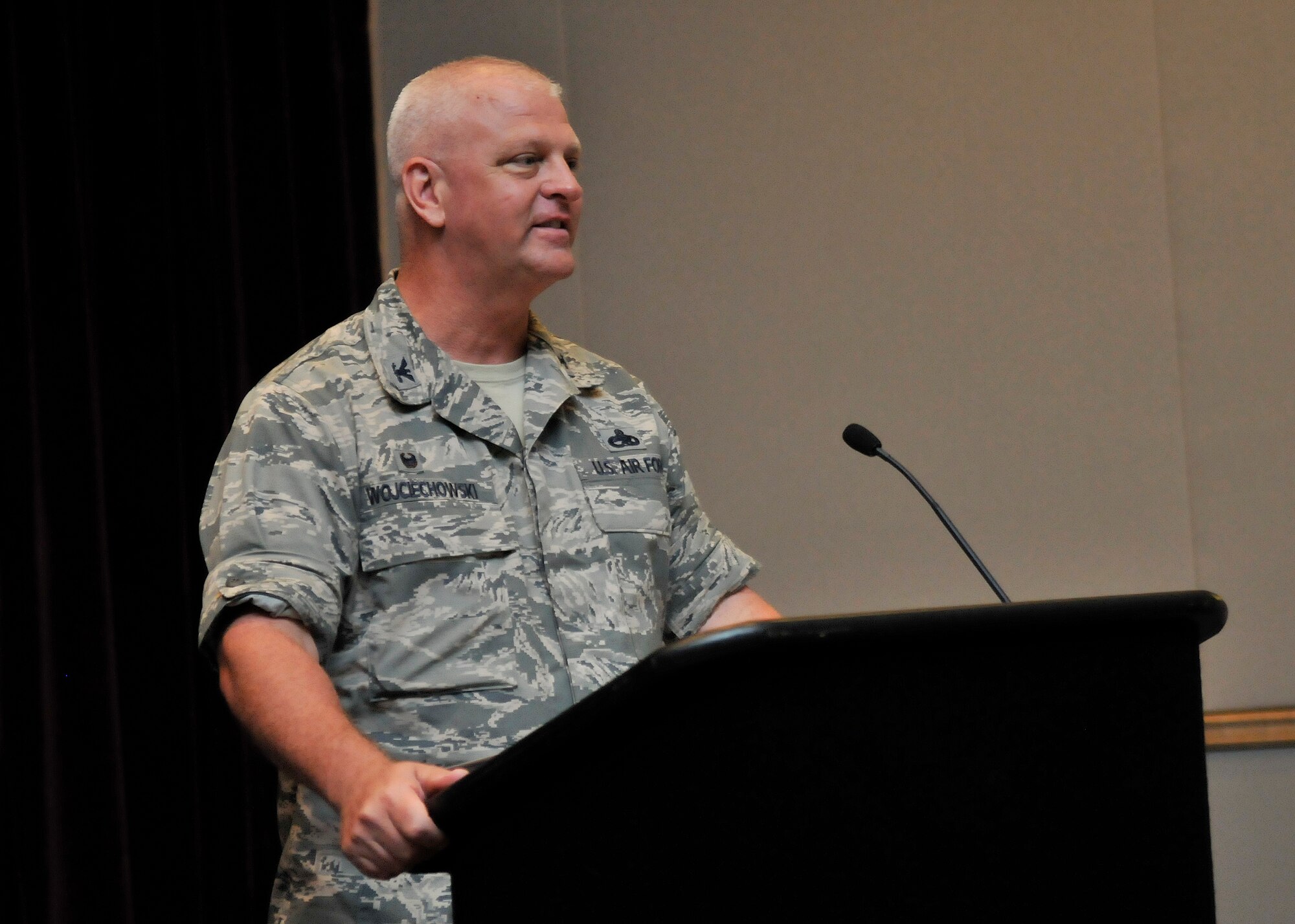 Col. Peter A. Wojciechowski addressed Airmen of the 920th Rescue Wing April 11, 2015 after assuming command of the 920th RQW Maintenance Group during a change-of-command ceremony at the Patrick Air Force Base, Florida Base Theater. Colonel Wojciechowski replaced Col. Charlene Nelson, who served as the 920th Maintenance Group Commander since April 2010. Colonel Nelson is now assigned as the 482nd Fighter Wing Maintenance Group Commander, Homestead Air Reserve Base, Fla. (U.S. Air Force photo/Tech. Sgt. Michael Means)