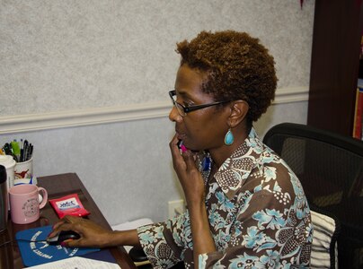 Jennifer Green, 628th Medical Group Family Advocacy Treatment manager, schedules an appointment April 14, 2015 at Joint Base Charleston – Air Base, S.C. The Family Advocacy Program or FAP was designed to prevent domestic abuse and child abuse and neglect by providing education and awareness programs for all members of the military community. (U.S. Air Force photo/Staff Sgt. AJ Hyatt)