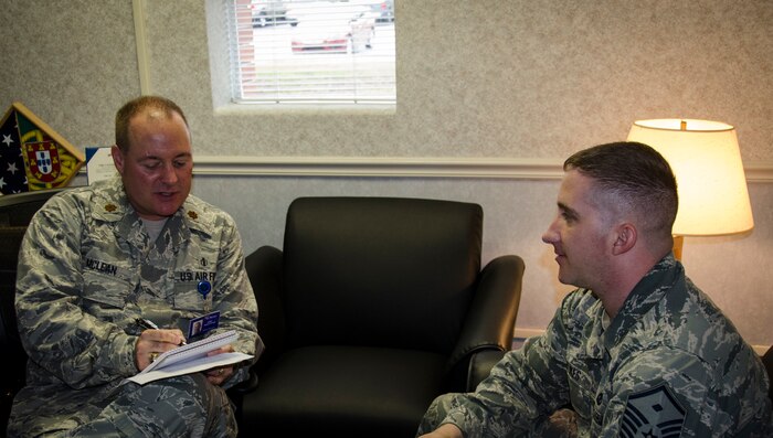 Maj. Jeffrey McLean, 628th Medical Group Family Advocacy Officer, discusses a referral with a first sergeant April 14, 2015 at Joint Base Charleston – Air Base, S.C. The Family Advocacy Program or FAP was designed to prevent domestic abuse and child abuse and neglect by providing education and awareness programs for all members of the military community. (U.S. Air Force photo/Staff Sgt. AJ Hyatt)