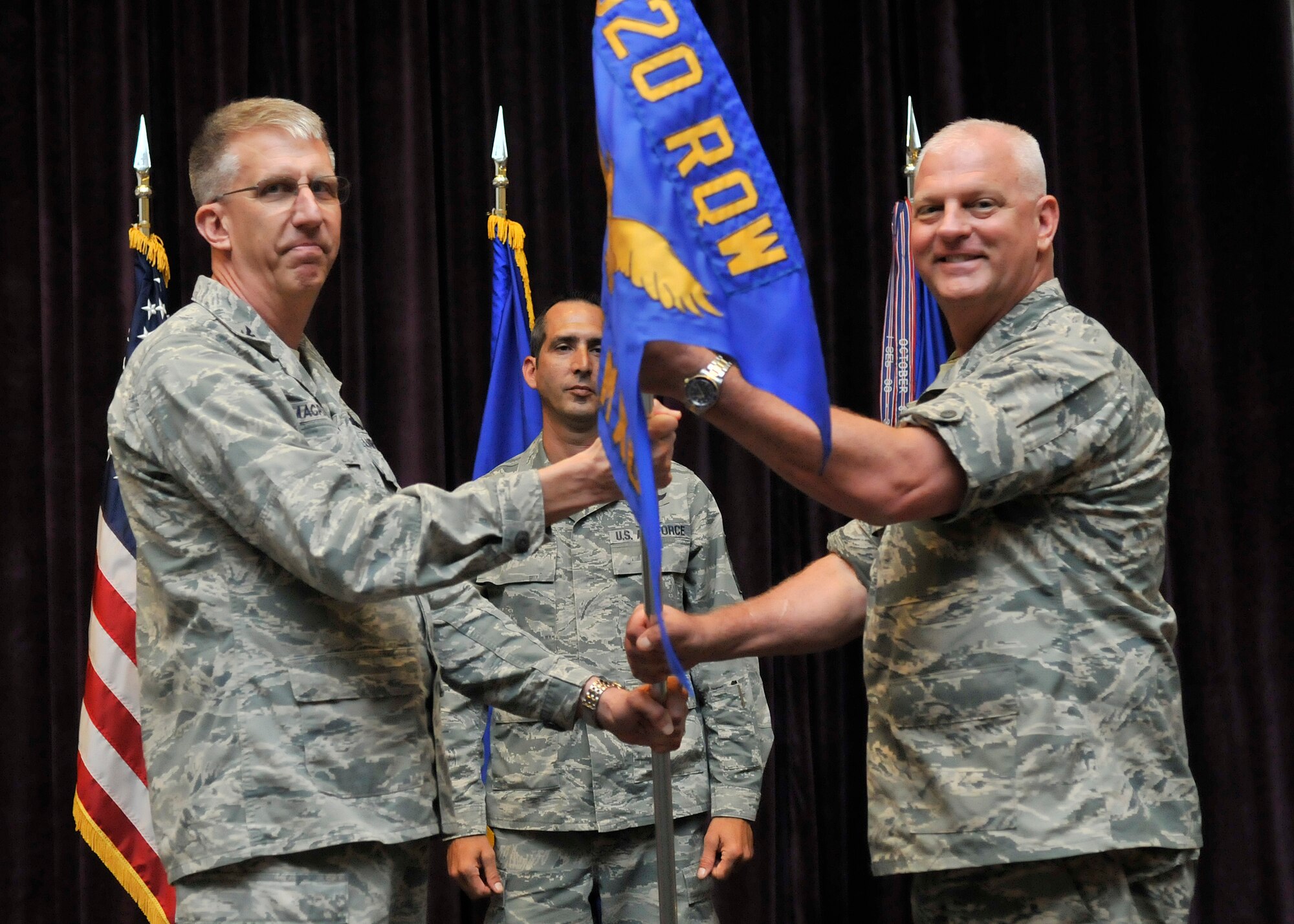 Col. Peter A. Wojciechowski (right) assumed command of the 920th Rescue Wing Maintenance Group on April 11 during a change-of-command ceremony at the Patrick Air Force Base, Florida Base Theater. Col. Jeffrey Macrander (left), presided over the ceremony. Colonel Wojciechowski replaced Col. Charlene Nelson, who served as the 920th Maintenance Group Commander since April 2010. Colonel Nelson is now assigned as the 482nd Fighter Wing Maintenance Group Commander, Homestead Air Reserve Base, Fla. (U.S. Air Force photo/Tech. Sgt. Michael Means)