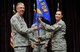 Col. Charlene Nelson (right) hands over the 920th Maintenance Group flag to Col. Jeffrey Macrander (left), 920th Rescue Wing commander, during a change of command ceremony at the Patrick Air Force Base, Florida Base Theater. Col. Nelson served as the 920th Maintenance Group Commander since April 2010 until she was relieved of duty to serve as the 482nd Fighter Wing Maintenance Group Commander, Homestead Air Reserve Base, Fla. (U.S. Air Force photo/Tech. Sgt. Michael Means)