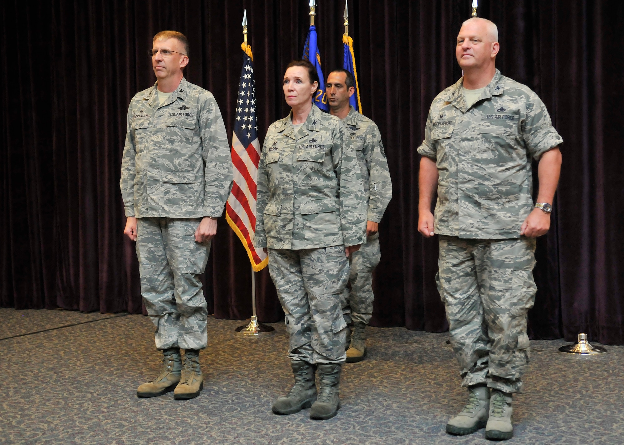 Col. Peter A. Wojciechowski (right) assumed command of the 920th Rescue Wing Maintenance Group on April 11 during a change-of-command ceremony at the Patrick Air Force Base, Florida Base Theater. Colonel Wojciechowski replaced Col. Charlene Nelson (center), who served as the 920th Maintenance Group Commander since April 2010. Colonel Nelson is now assigned as the 482nd Fighter Wing Maintenance Group Commander, Homestead Air Reserve Base, Fla. Col. Jeffrey Macrander, 920th RQW commander (left) presided over the ceremony. (U.S. Air Force photo/Tech. Sgt. Michael Means)