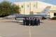 Personnel from the 162nd Wing Host Aviation Resource Management office pose for a group photo in front of one of the wing's F-16 Falcon's. The wing HARM office won the Sergeant Dee Campbell Outstanding Aviation Resource Management Large Unit of the Year award for 2014, and were presented with the award April 11 during the wing's annual awards ceremony.