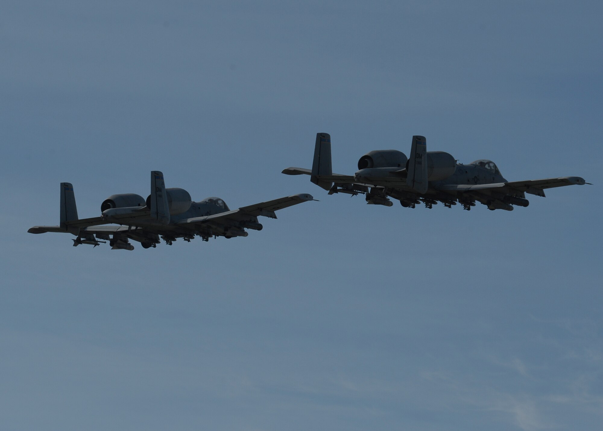 Two U.S. Air Force A-10 Thunderbolt II aircraft assigned to the 354th Expeditionary Fighter Squadron take off from a runway during a theater security package deployment at Campia Turzii, Romania, April 14, 2015. U.S. Airmen will conduct training alongside NATO allies to strengthen interoperability and demonstrate U.S. commitment to the security and stability of Europe. (U.S. Air Force photo by Staff Sgt. Joe W. McFadden/Released)