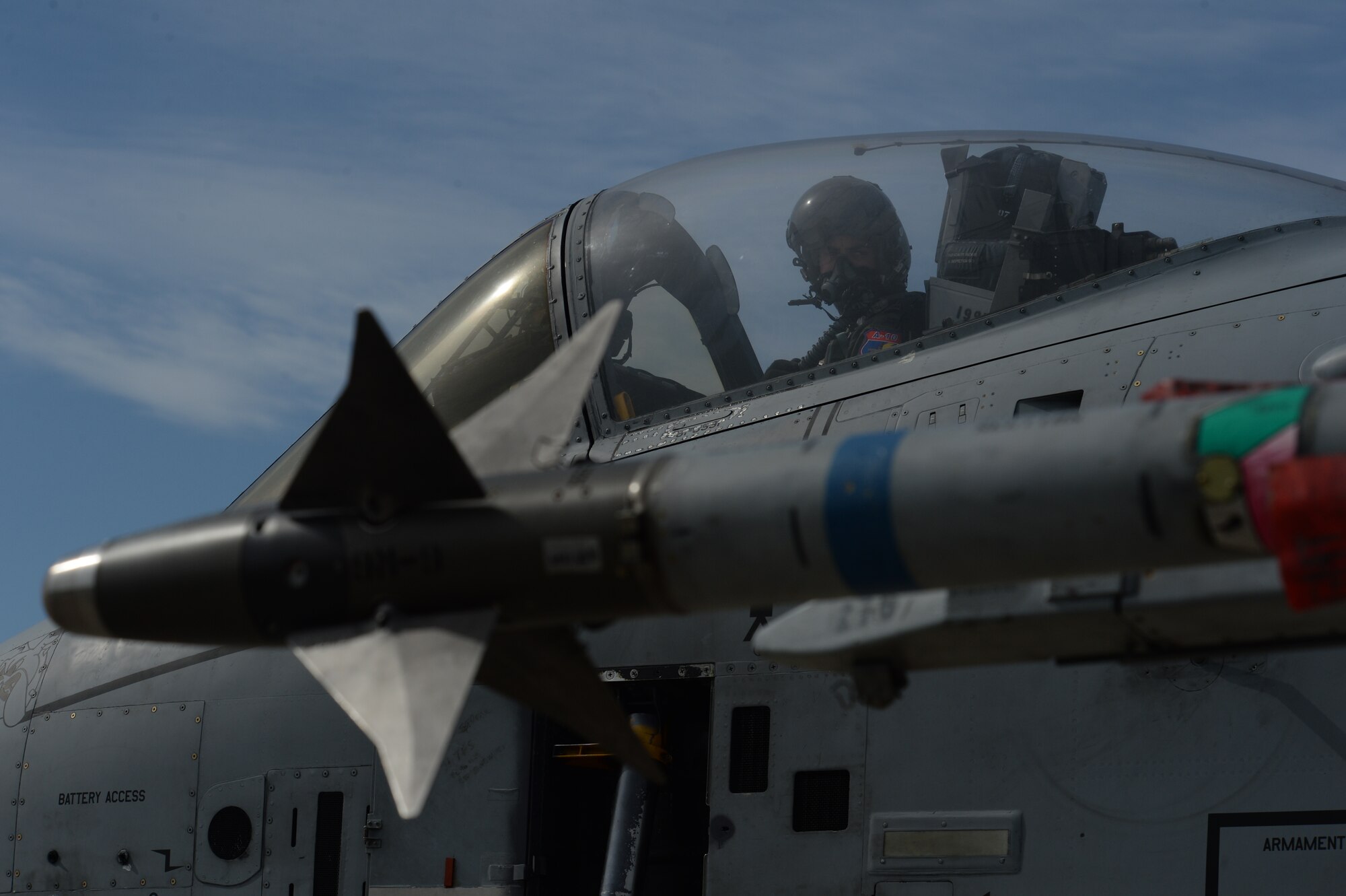A U.S. Air Force A-10 Thunderbolt II pilot assigned to the 354th Expeditionary Fighter Squadron looks back from the cockpit of his aircraft before taxiing on the runway during a theater security package deployment at Campia Turzii, Romania, April 14, 2015. The aircraft will conduct training alongside NATO allies to strengthen interoperability and demonstrate U.S. commitment to the security and stability of Europe.  (U.S. Air Force photo by Staff Sgt. Joe W. McFadden/Released)
