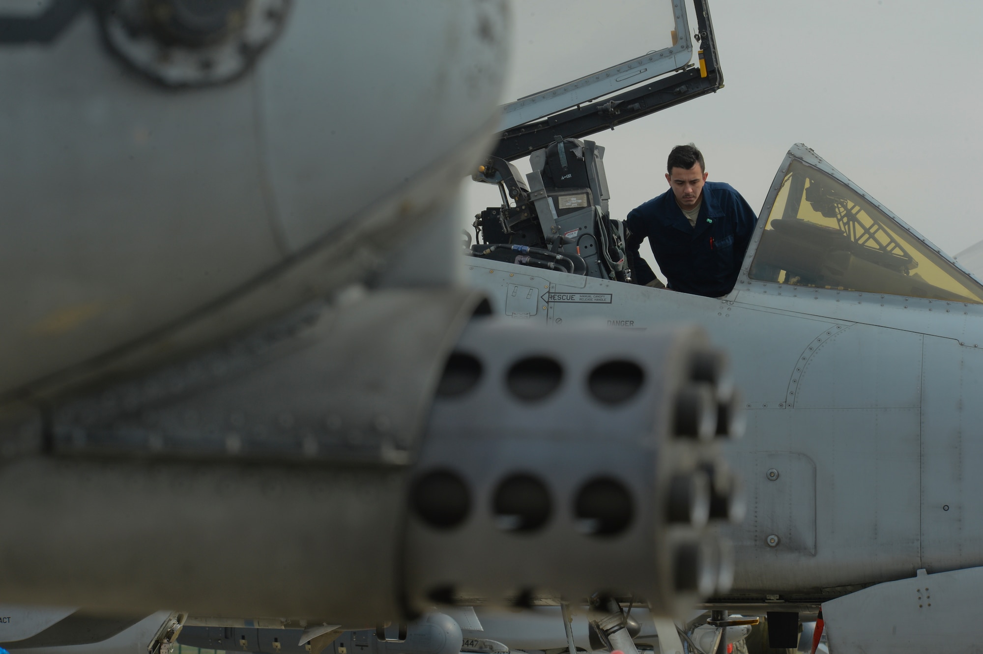A U.S. Air Force crew chief assigned to the 354th Expeditionary Fighter Squadron inspects the cockpit of an A-10 Thunderbolt II during a theater security package deployment at Campia Turzii, Romania, April 14, 2015. The aircraft will forward deploy to locations in Eastern European NATO countries as part of the TSP. (U.S. Air Force photo by Staff Sgt. Joe W. McFadden/Released)