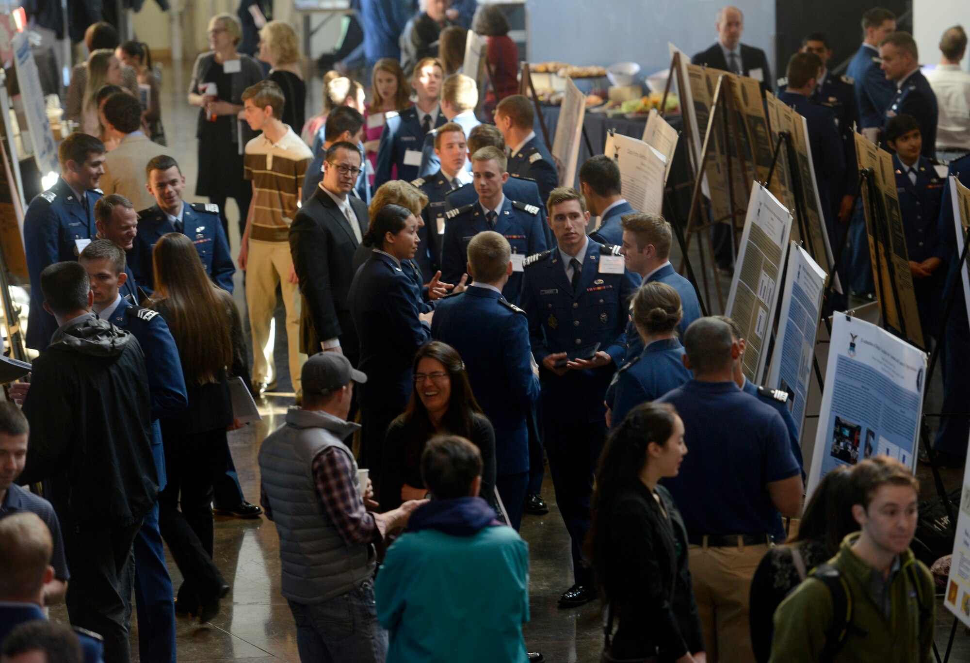U.S. Air Force Academy cadets mingle with other college students at the Colorado Springs Undergraduate Research Forum, April 4, 2015 at the University of Colorado-Colorado Springs. CSURF is an annual event featuring the best of undergraduate research and allows local students to discuss their latest research projects. (Used with permission of Colorado College/Bryan Oller)