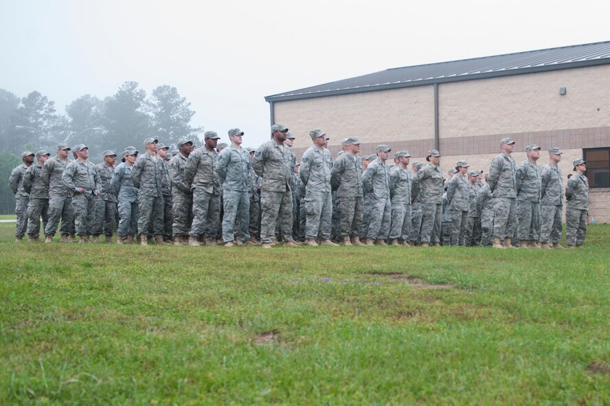 Members from the 823d Base Defense Squadron stand in formation before deploying during a ceremony April 14, 2015, at Moody Air Force Base, Ga. Moody’s base defense squadrons deploy as a whole on a six-months on, six-months off schedule. (U.S. Air Force photo by Airman 1st Class Dillian Bamman/Released)