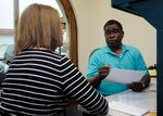 Michael German, Joint Base San Antonio-Randolph certified volunteer tax consultant, prepares taxes for Dorian Henley, spouse of retired Navy Senior Chief Jesse Henley, March 19 at the JBSA-Randolph tax center.  (U.S. Air Force photo by Harold China)

