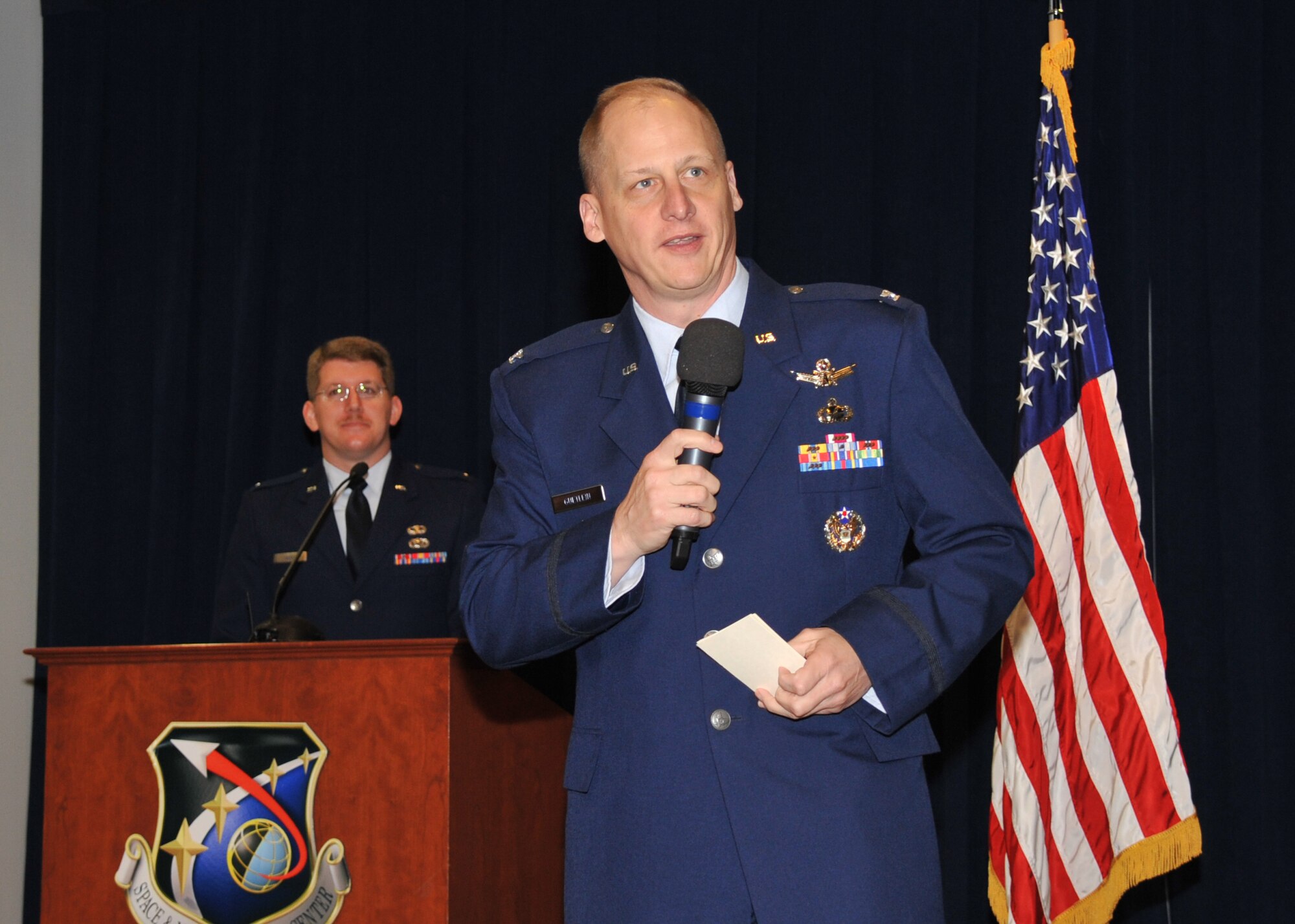 U. S. Air Force Col. Michael A. Guetlein, the first director of the Remote Sensing Systems Directorate, Space and Missile Systems Center, addresses the crowd during the RS Activation Ceremony held at Los Angeles Air Force Base in El Segundo, Calif., on March 23, 2015.   SMC/RS merges the Defense Weather Systems Directorate (SMC/WM) and the Infrared Space Systems Directorate (SMC/IS), thereby merging SMC’s missile warning/missile defense and environmental monitoring missions.  (U.S. Air Force photo by Sarah Corrice)