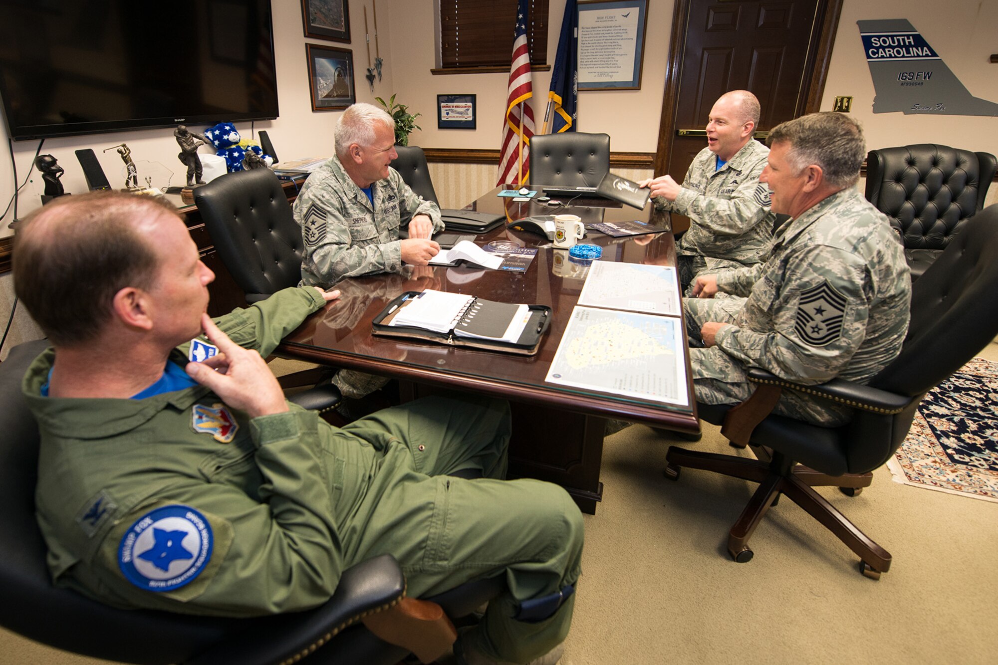 U.S. Air Force Chief Master Sgt. James W. Hotaling (back row), Command Chief Master Sgt. for the Air National Guard, meets with Col. David Meyer, 169th Fighter Wing commander, S.C. State Command Chief Master Sgt. Dean Widener (center-right) and 169th Fighter Wing Command Chief Stephen Shepherd (center-left), during a visit to the South Carolina Air National Guard at McEntire Joint National Guard Base, S.C., April 11, 2015. Hotaling hosted town hall meetings to engage Swamp Fox Airmen in the discussion of three key points; the profession of arms, the health of the force and recognizing and renewing commitments to Airmen.  (U.S. Air National Guard photo by Tech. Sgt. Jorge Intriago/RELEASED)