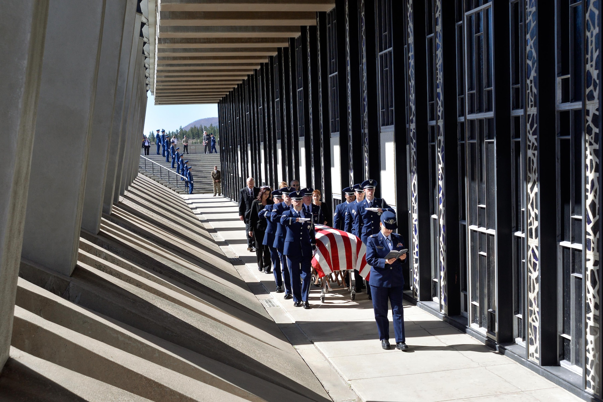 Rabbi (Maj.) Sarah Schechter, a Cadet Chapel Jewish chaplain, reads Psalms while the U.S. Air Force Academy Honor Guard escorts the casket containing the remains of Capt. Richard D. Chorlins, an Academy Class of ’67 graduate, into the Cadet Chapel April 14, 2015. Chorlins was killed in Vietnam in January 1970. His remains were transferred here April 13, 2015 in a dignified arrival ceremony and he was laid to rest at the U.S. Air Force Academy Cemetery April 14, 2015. (U.S. Air Force photo/Liz Copan)