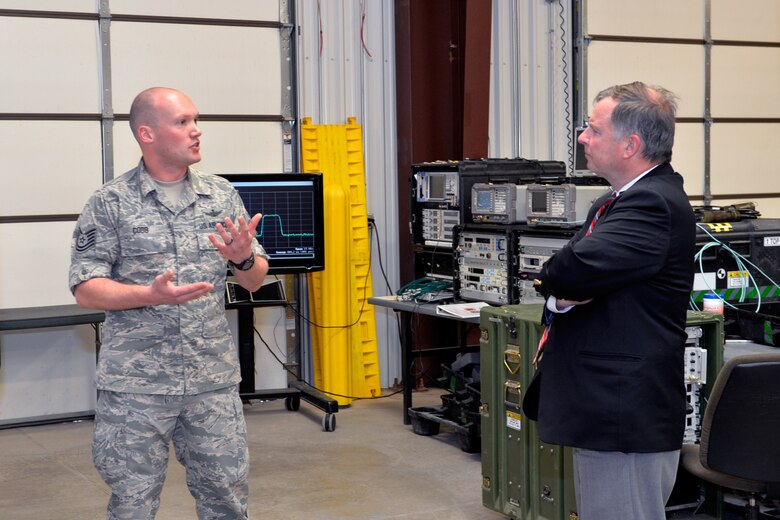 Congressman Douglas Lamborn, Colorado, visits with Tech. Sgt. Joshua Cobb, 527th Space Aggressors Squadron, April 1, 2015, at Schriever Air Force Base, Colo. The goal of the visit was for Lamborn to familiarize himself with the 527 SAS mission. (Courtesy Photo)