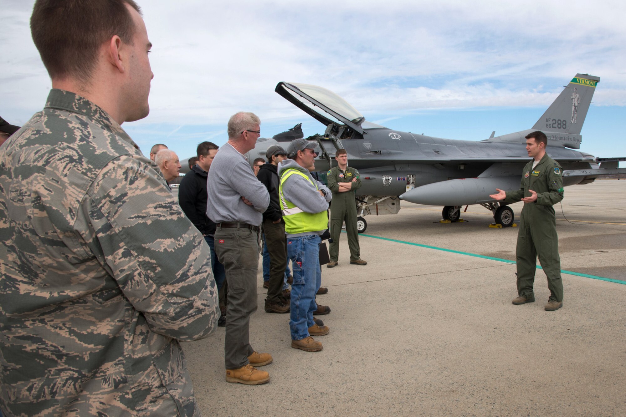 Capt. Justin "Britches" Moreland, pilot assigned to the 158th Fighter Wing from the Vermont Air National Guard, speaks to members of the Hanscom community on the flightline before returning to home station April 14. The Vermont Air National Guard participated in the Boston Red Sox opening day festivities at Fenway Park the day before. (U.S. Air Force photo by Mark Herlihy)