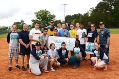 Joint Base Charleston Sexual Assault Prevention and Response team members pose with the 2015 Sexual Assault Awareness and Prevention Month kickball tournament champions at Locklear Park on Joint Base Charleston Weapons Station, April 11, 2015.  More than 30 teams and 400 players participated in the event to raise awareness of sexual assault. (U.S. Navy / Electronics Technician 2nd Class Brittany Pastrick / Released)