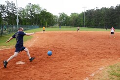 Naval Nuclear Power Training Command Command Master Chief Ronald Nagy kicks a ball to NNPTC students at the 2015 Sexual Assault Awareness and Prevention Month kickball tournament held at Locklear Park on Joint Base Charleston Weapons Station, April 11, 2015.  The event provided a unique opportunity for junior service members to bond with their supervisors while working for a common goal. (U.S. Navy photo / Mass Communication Specialist 2nd Class Jason Pastrick)