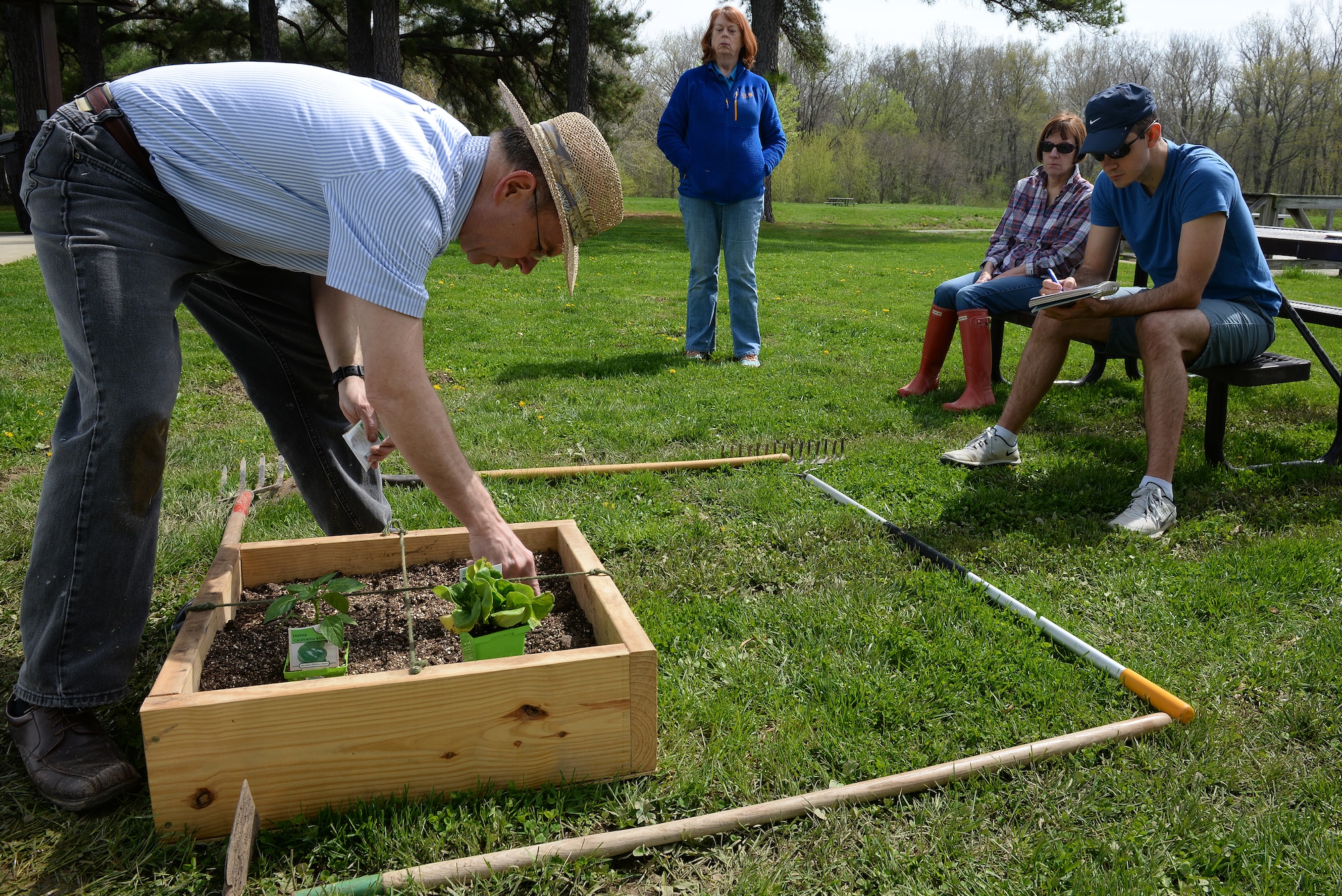 Jonathan Svoboda, President of the Lebanon Gardening Club, assembles a square-foot gardening demonstration at Scott Air Force Base, Illinois, April 11, 2015. He showed interested gardeners about the how they can integrate caring for plants into their lives, and one way to do that and keep it organized is through square-foot gardening, which is based on adequate spacing plants need to flourish. (U.S. Air Force photo by Airman 1st Class Erica Crossen)