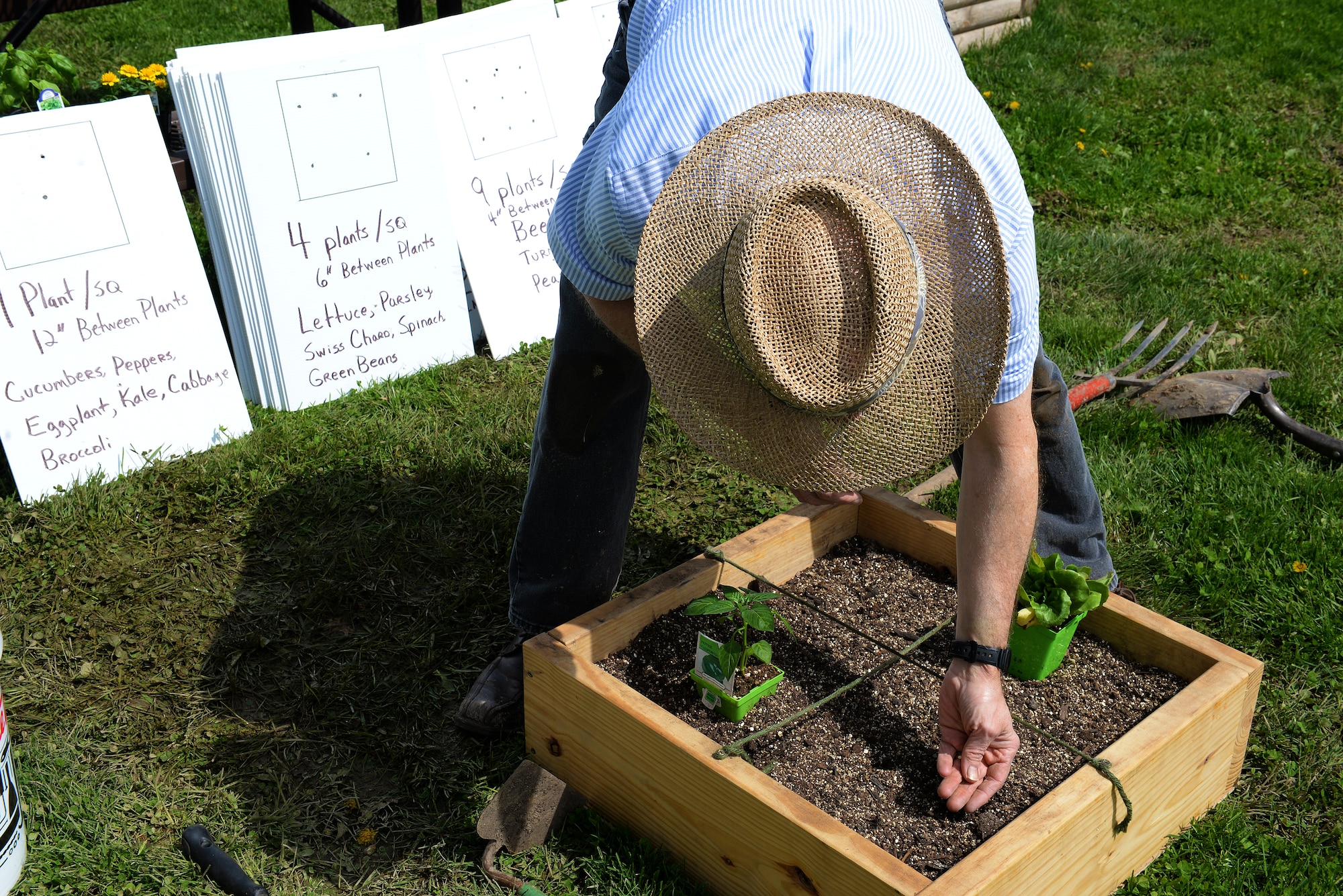 Jonathan Svoboda, President of the Lebanon Gardening Club, assembles a square-foot gardening demonstration at Scott Air Force Base, Illinois, April 11, 2015. He showed interested gardeners about the how they can integrate caring for plants into their lives, and one way to do that and keep it organized is through square-foot gardening, which is based on adequate spacing plants need to flourish. (U.S. Air Force photo by Airman 1st Class Erica Crossen)