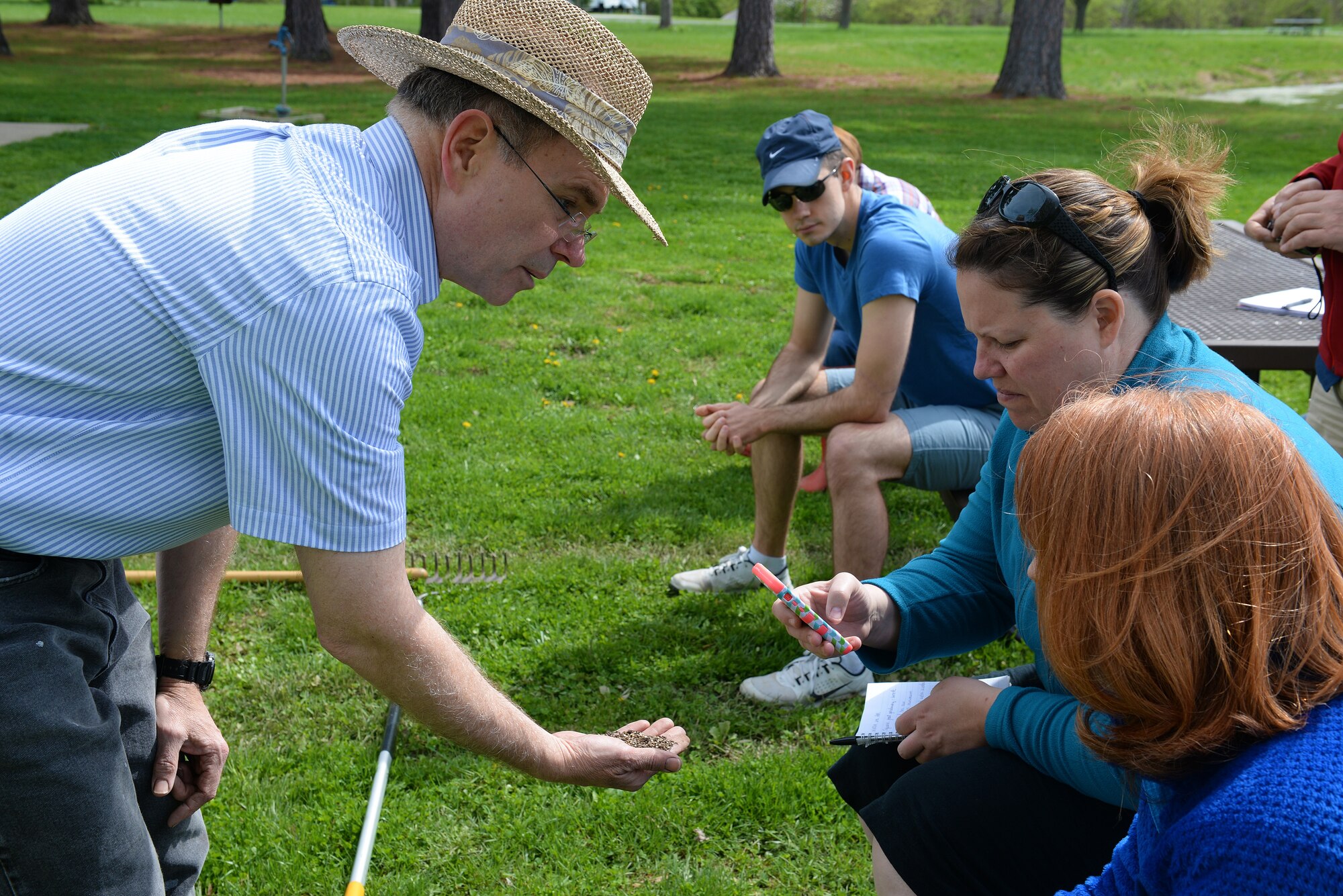 Jonathan Svoboda, President of the Lebanon Gardening Club, shows base community members the ideal mixture of soil at Scott Air Force Base, Illinois, April 11, 2015. He showed interested gardeners about the how they can integrate caring for plants into their lives, even if it’s a windowsill garden or rows and rows of vegetables. (U.S. Air Force photo by Airman 1st Class Erica Crossen)