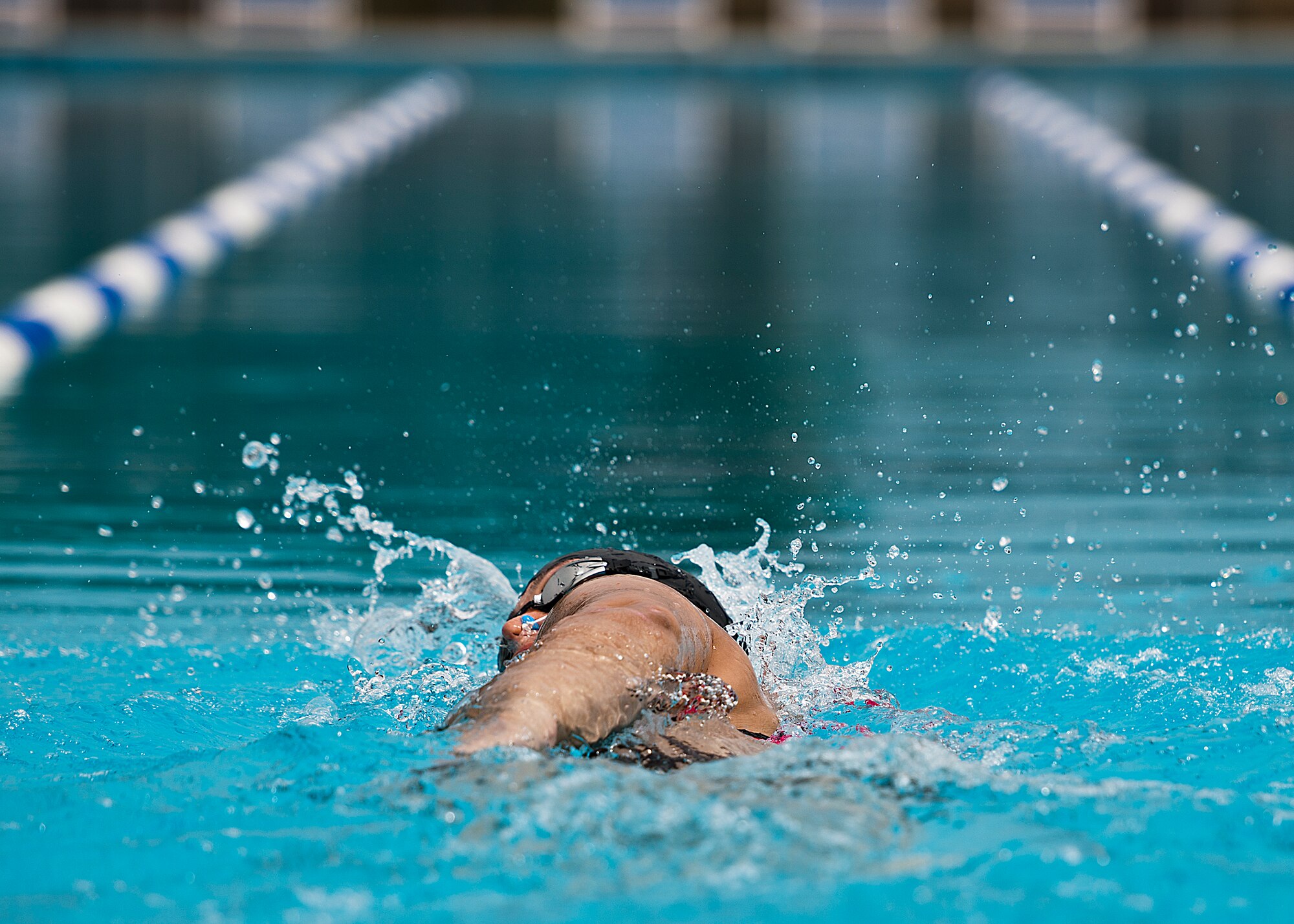 Jen Stone, an Air Force Wounded Warrior athlete, swims laps during the second day of an introductory adaptive sports and rehabilitation camp at Eglin Air Force Base, Fla., April 14. The DOD’s military adaptive sports program enhances warrior recovery by engaging wounded, ill and injured service members in ongoing, daily adaptive activities, based on their interest and ability. (U.S. Air Force photo/Samuel King Jr.)