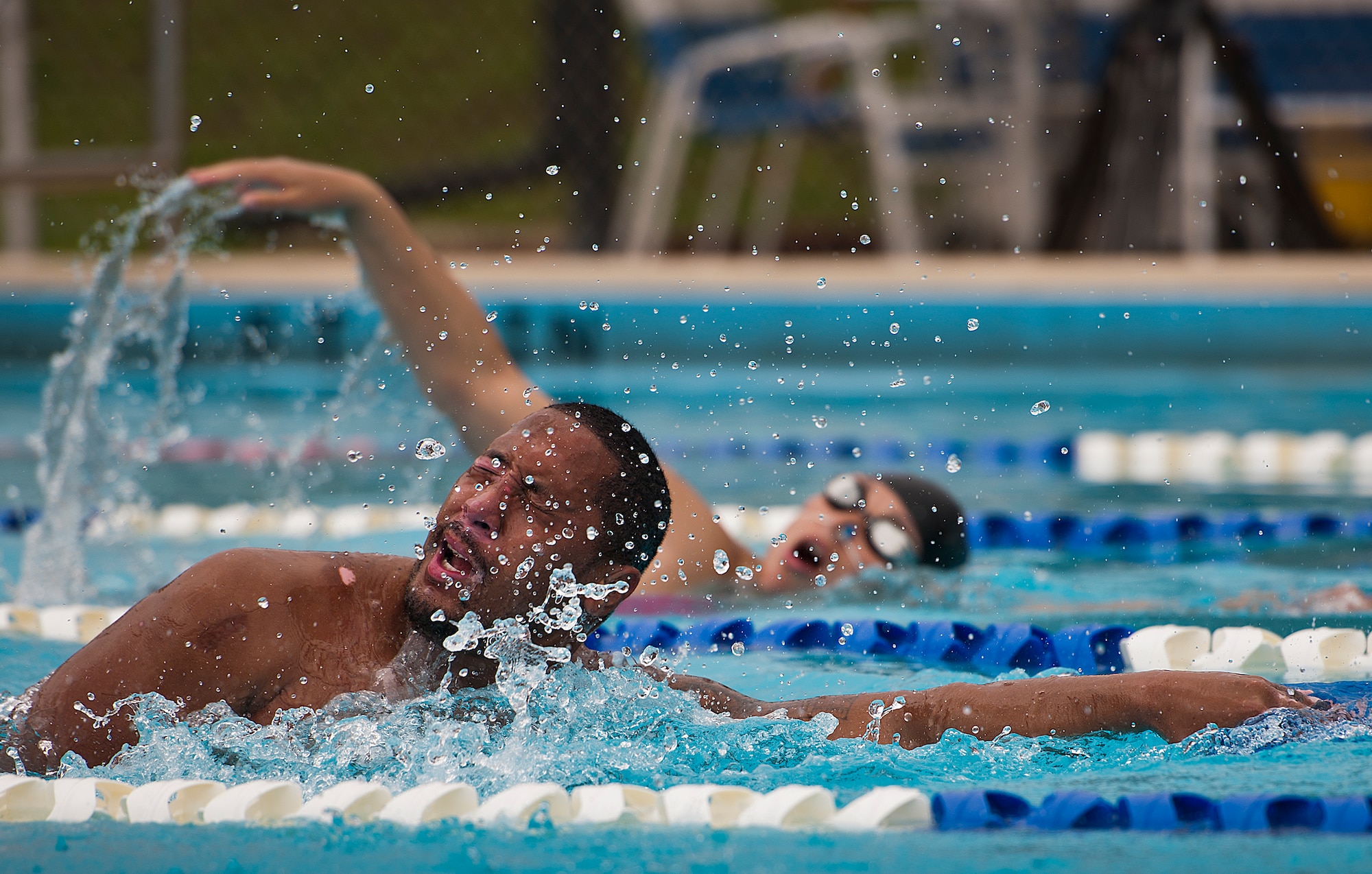 Tino Uli, an Air Force Wounded Warrior athlete, comes up for breath while swimming laps during the second day of an introductory adaptive sports and rehabilitation camp at Eglin Air Force Base, Fla., April 14. The DOD’s military adaptive sports program enhances warrior recovery by engaging wounded, ill and injured service members in ongoing, daily adaptive activities, based on their interest and ability. (U.S. Air Force photo/Samuel King Jr.)