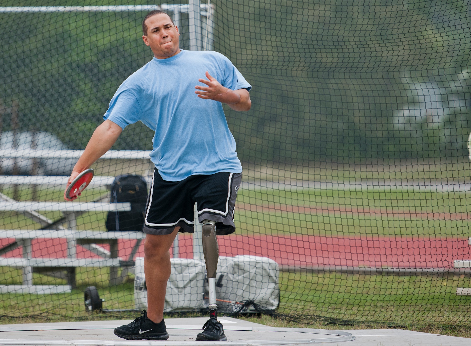 Brian Williams, an Air Force Wounded Warrior athlete, prepares to throw the discus during the second day of an introductory adaptive sports and rehabilitation camp at Eglin Air Force Base, Fla., April 14. The DOD’s military adaptive sports program enhances warrior recovery by engaging wounded, ill and injured service members in ongoing, daily adaptive activities, based on their interest and ability. (U.S. Air Force photo/Samuel King Jr.)