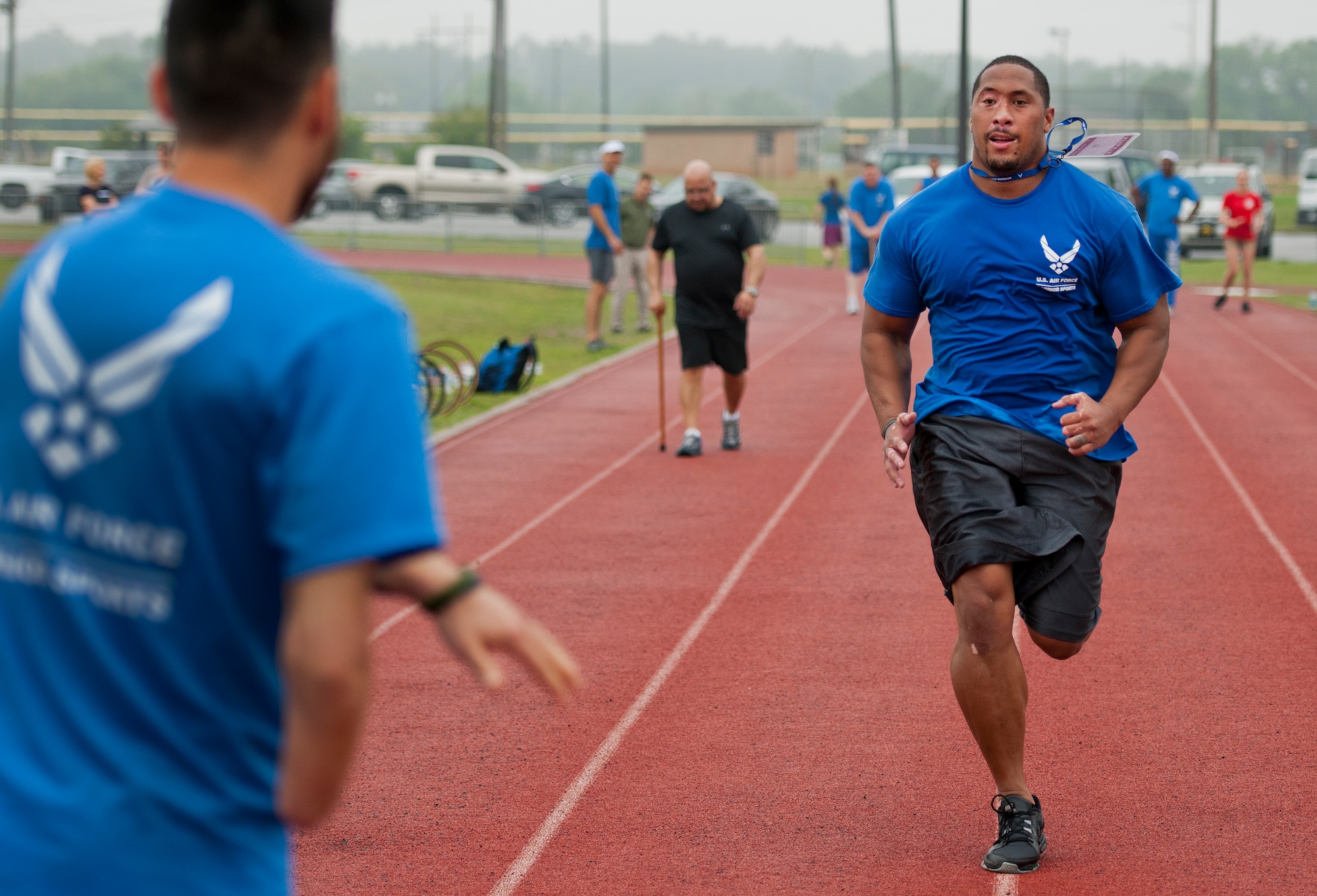 Tino Uli sprints to tag his partner during a relay race at the second day of an introductory adaptive sports and rehabilitation camp at Eglin Air Force Base, Fla., April 14. The DOD’s military adaptive sports program enhances warrior recovery by engaging wounded, ill and injured service members in ongoing, daily adaptive activities, based on their interest and ability. (U.S. Air Force photo/Samuel King Jr.)