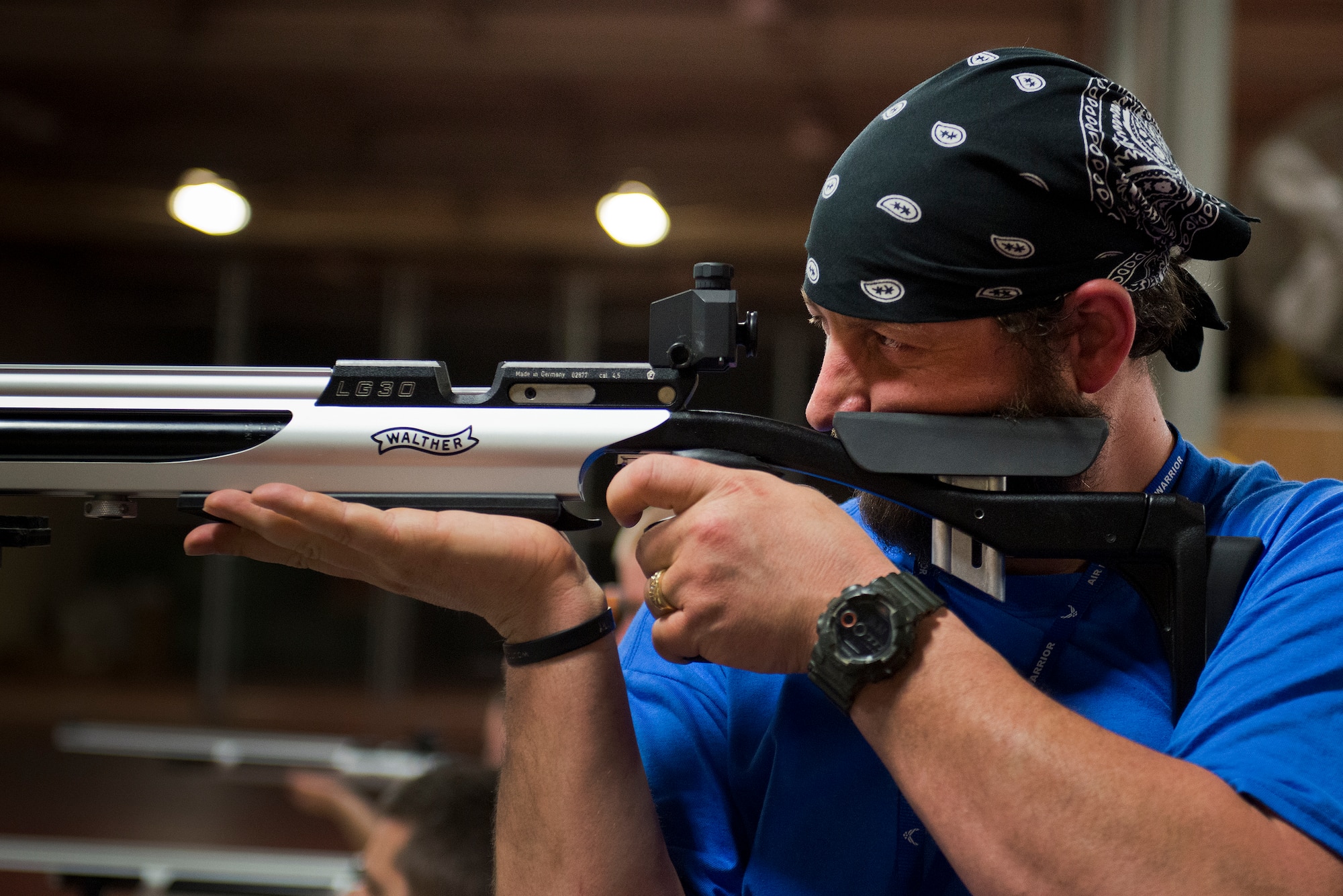 Cory Anderson, an Air Force Wounded Warrior athlete, takes aim at his target during a shooting session at the second day of an introductory adaptive sports and rehabilitation camp at Eglin Air Force Base, Fla., April 14. The DOD’s military adaptive sports program enhances warrior recovery by engaging wounded, ill and injured service members in ongoing, daily adaptive activities, based on their interest and ability. (U.S. Air Force photo/Samuel King Jr.)