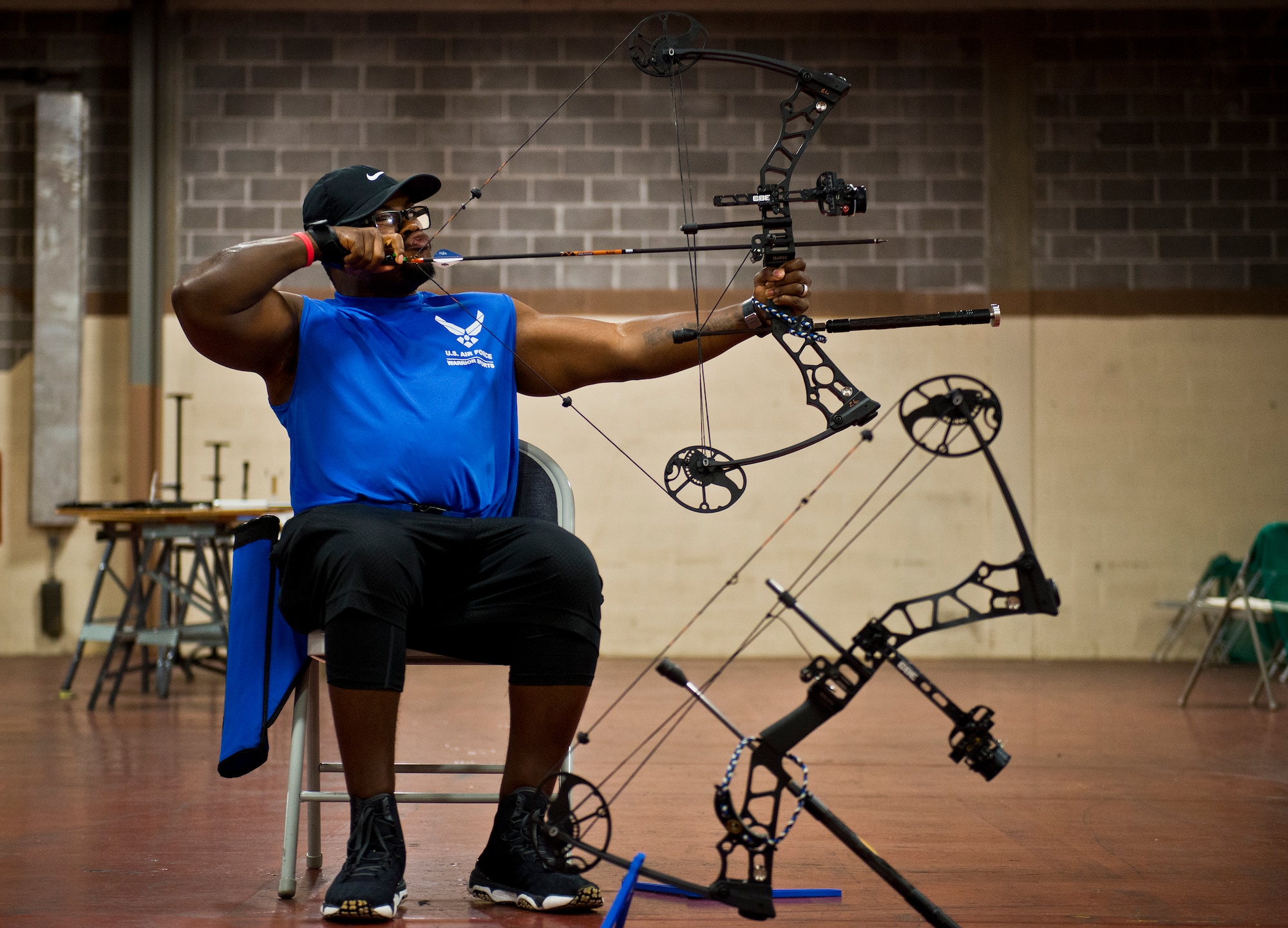 Tremayne Maxwell, an Air Force Wounded Warrior athlete, lines up his shot during an archery class at the second day of an introductory adaptive sports and rehabilitation camp at Eglin Air Force Base, Fla., April 14. The DOD’s military adaptive sports program enhances warrior recovery by engaging wounded, ill and injured service members in ongoing, daily adaptive activities, based on their interest and ability. (U.S. Air Force photo/Samuel King Jr.)