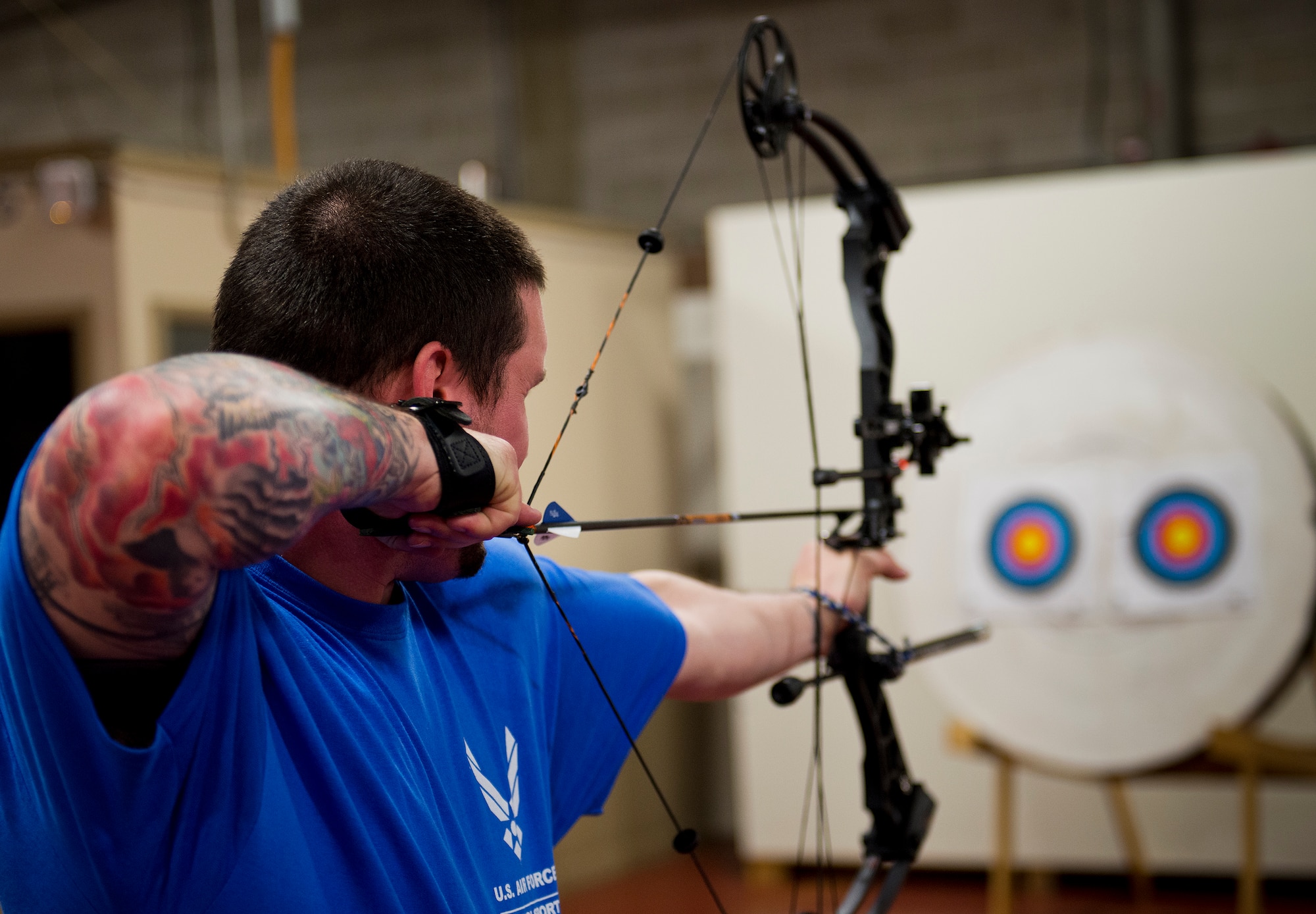 Paul Verhulst, an Air Force Wounded Warrior athlete, lines up his shot during an archery class at the second day of an introductory adaptive sports and rehabilitation camp at Eglin Air Force Base, Fla., April 14. The DOD’s military adaptive sports program enhances warrior recovery by engaging wounded, ill and injured service members in ongoing, daily adaptive activities, based on their interest and ability. (U.S. Air Force photo/Samuel King Jr.)