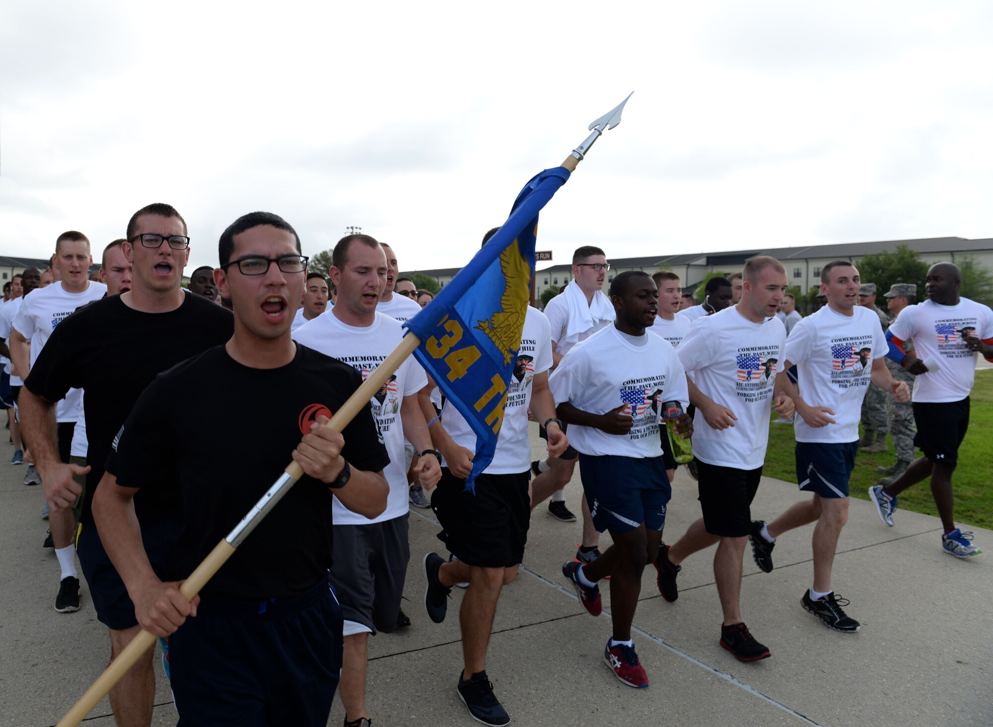 Members of the 334th Training Squadron run in formation during the Holt Memorial 5K Run/Walk April 10, 2015 at the Levitow Training Support Facility, Keesler Air Force Base, Miss. More than 200 Keesler personnel participated in the run honoring Airman 1st Class Antoine Holt, who received his technical training at the 334th TRS and was killed in 2004 while deployed in Iraq. The event was sponsored by the African-American Heritage Committee and 334th TRS. (U.S. Air Force photo by Airman 1st Class Duncan McElroy)