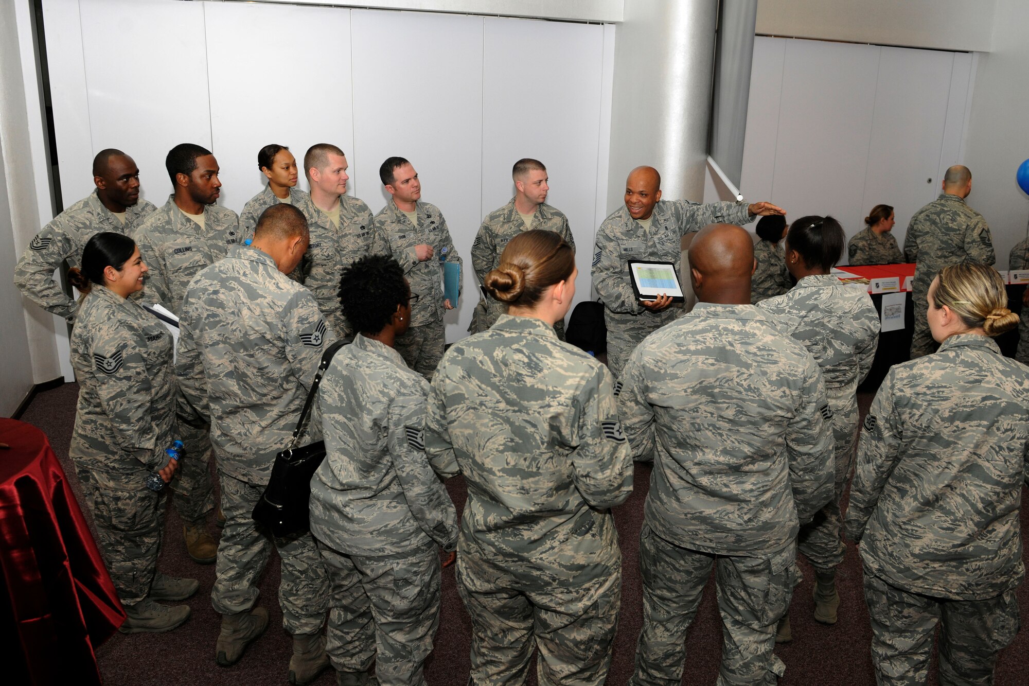 Master Sgt. Robert Mills, 39th Force Support Squadron career assistance advisor, briefs Airmen participating in a speed mentoring event April 13, 2015, at Incirlik Air Base, Turkey. The session was modeled off the speed dating concept and consisted of Airmen meeting with mentors for 6 minutes each rotation. (U.S. Air Force photo by Senior Airman Krystal Ardrey/Released) 